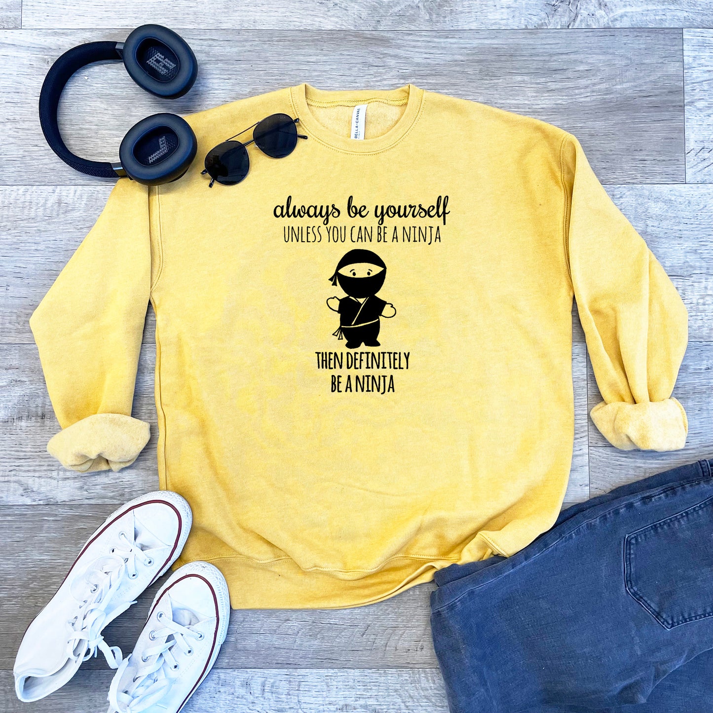 a yellow sweatshirt with a picture of a monkey on it