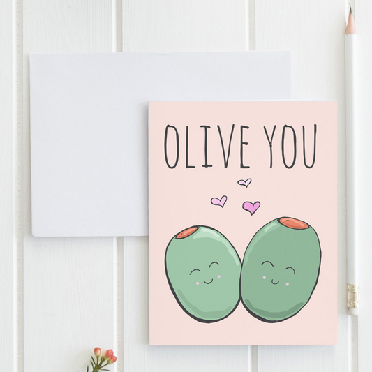 a greeting card with two green eggs on a pink background