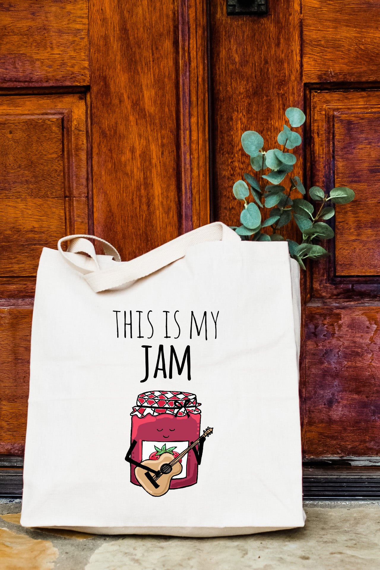 a tote bag with a picture of a jar of jam on it