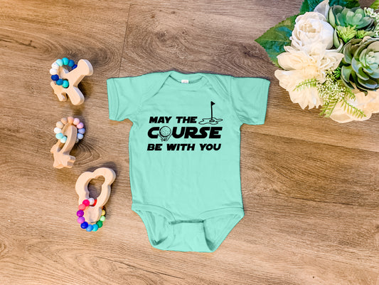 a baby's bodysuit with the words, may the course be with you