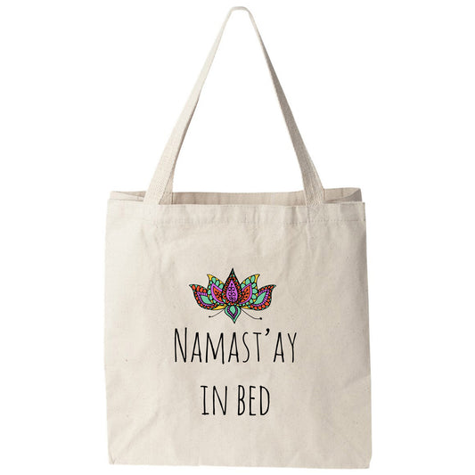 a tote bag that says namast ya in bed