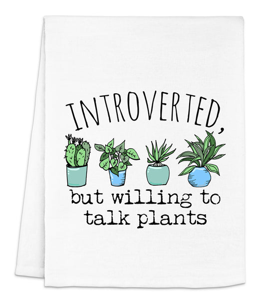 a white dish towel with a potted plant saying