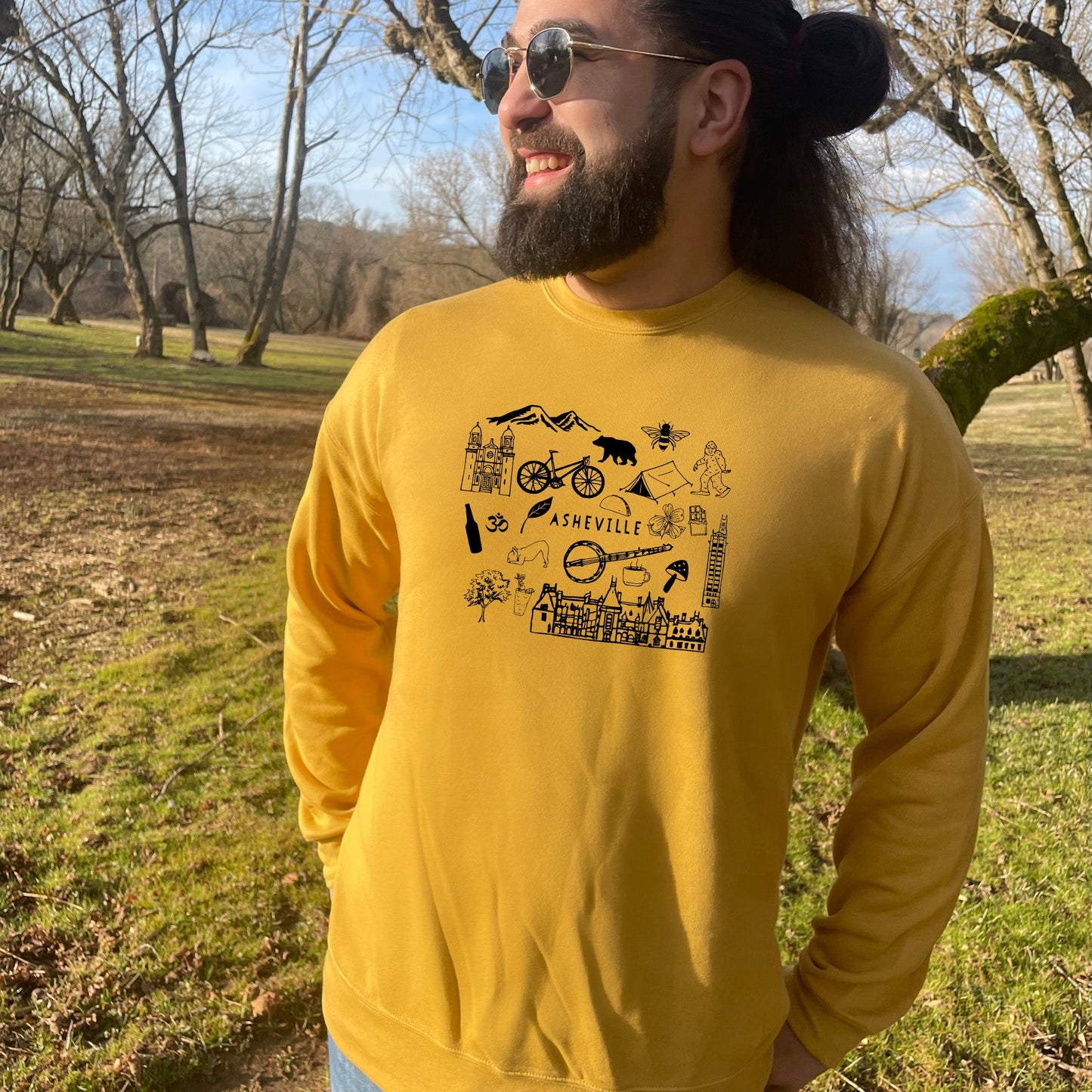 a man with long hair and a beard wearing a yellow shirt