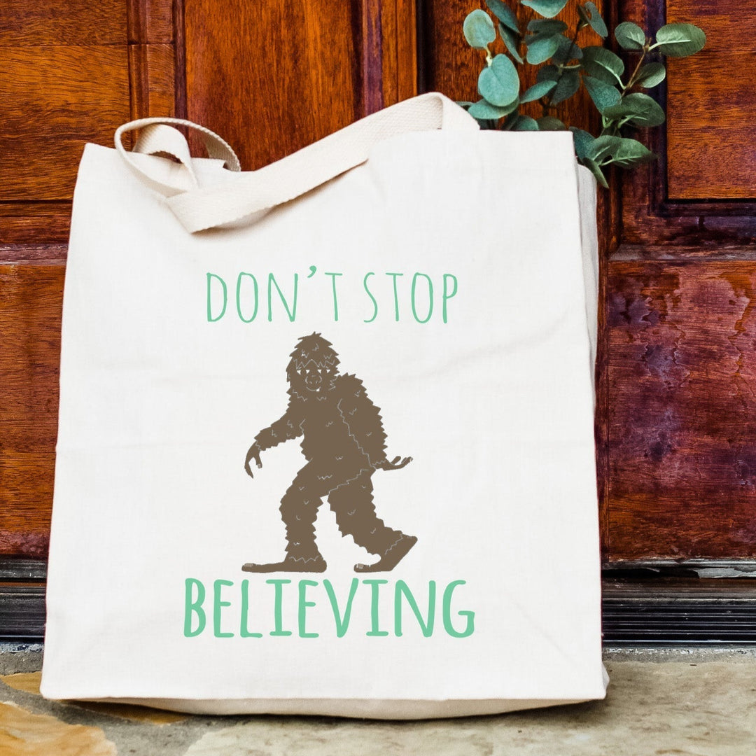 a white bag sitting on the ground next to a door