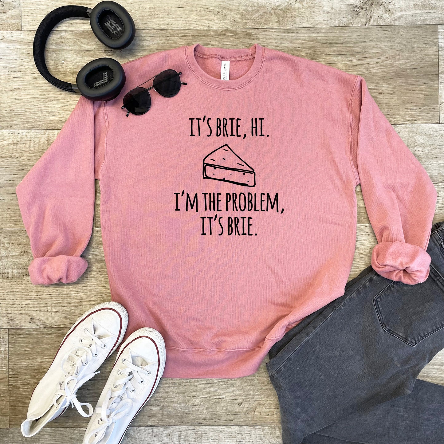 a pink sweatshirt with a piece of cake on it