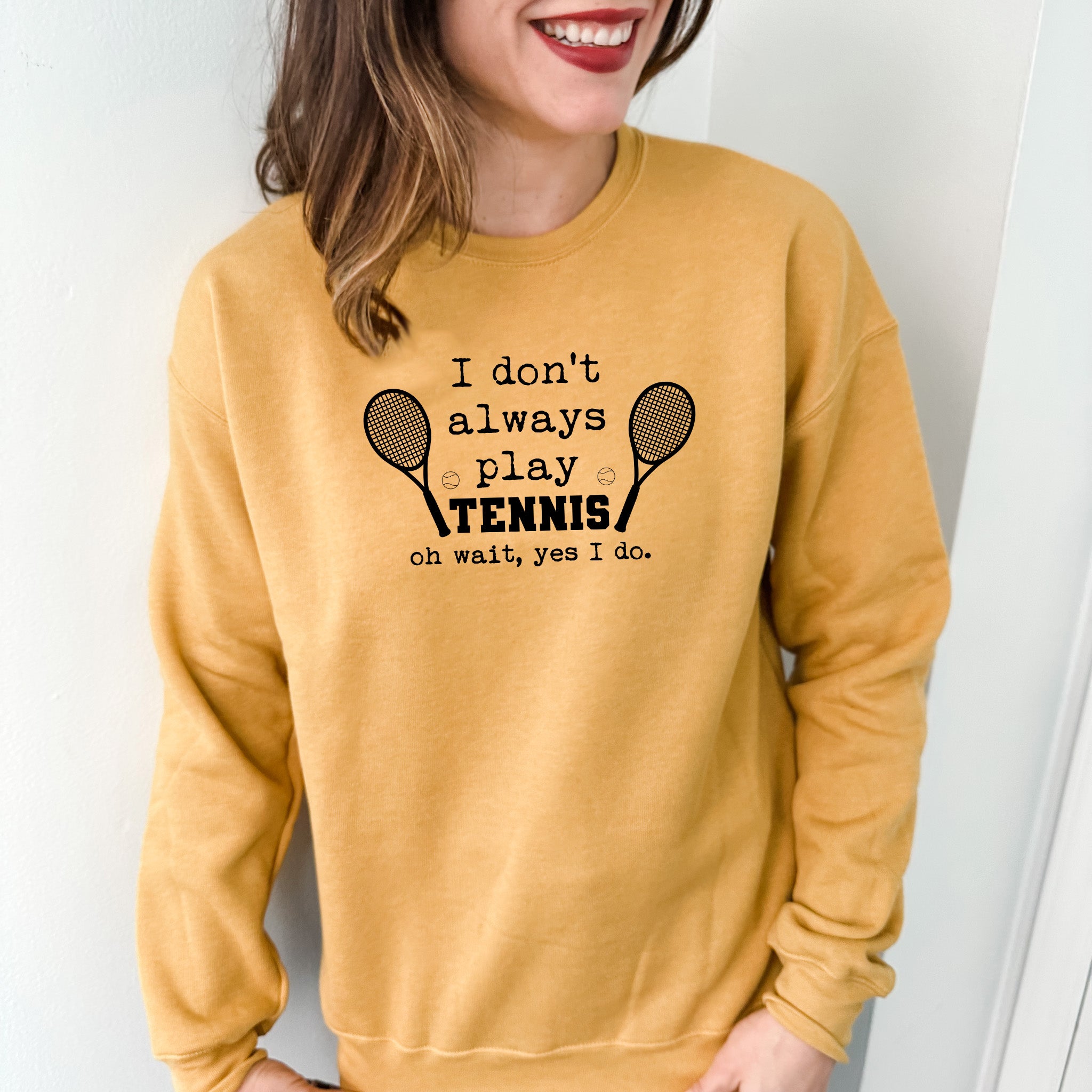 a woman wearing a sweatshirt that says i don't always play tennis on what
