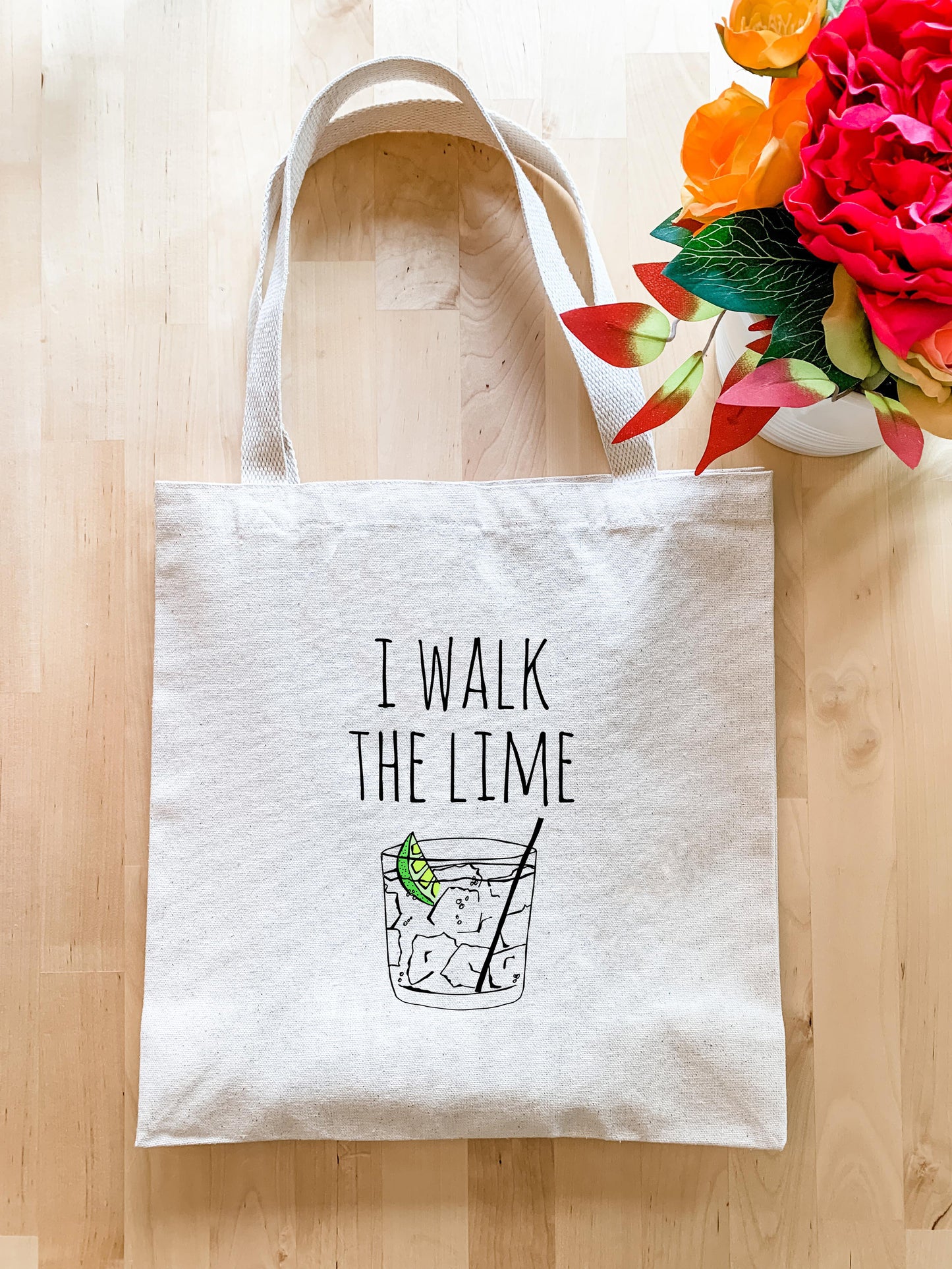 a white tote bag with the words i walk the lime on it