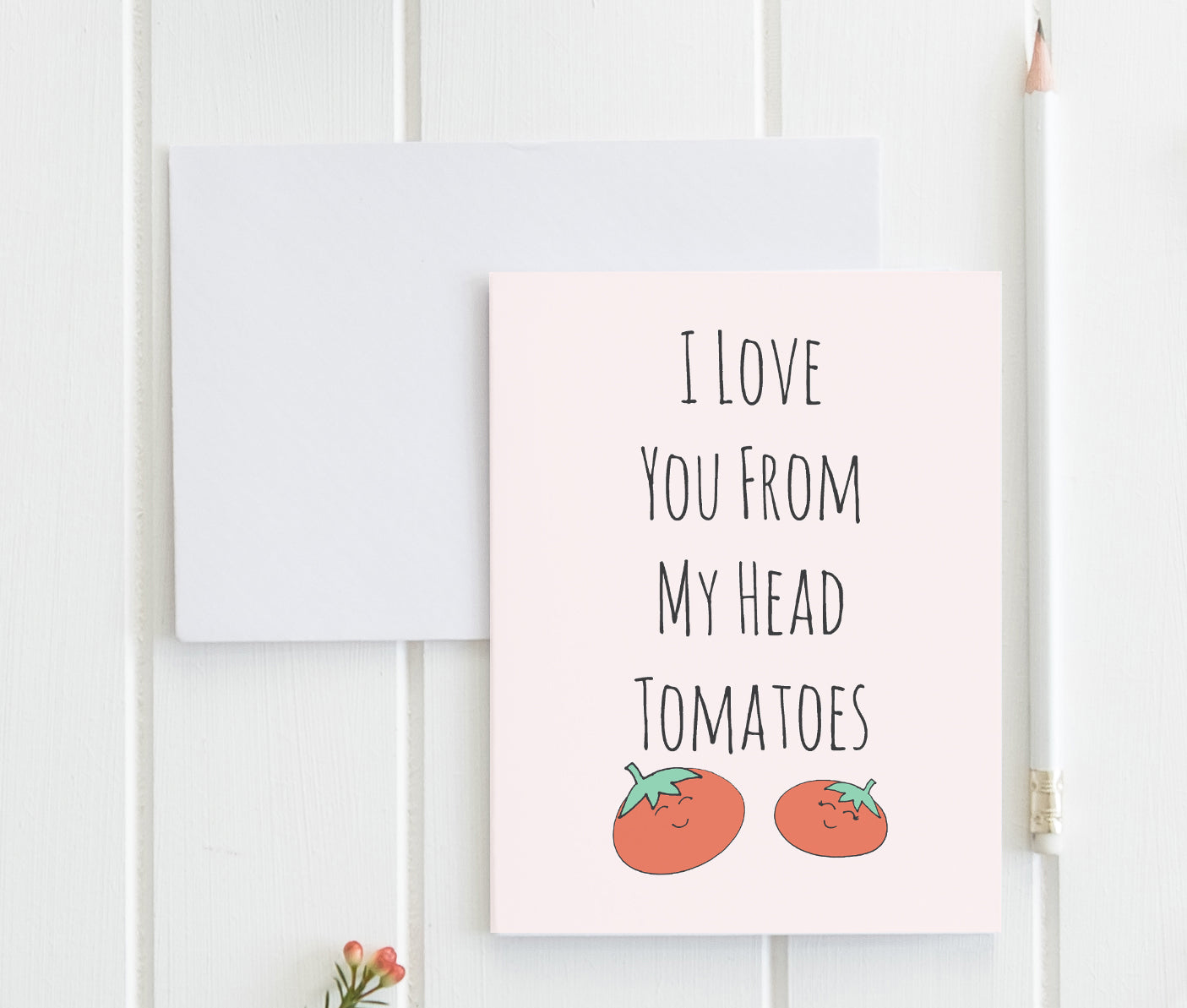 a card with two tomatoes on it and the words i love you from my head