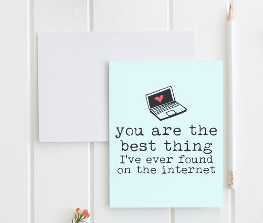 a card with a laptop on top of it
