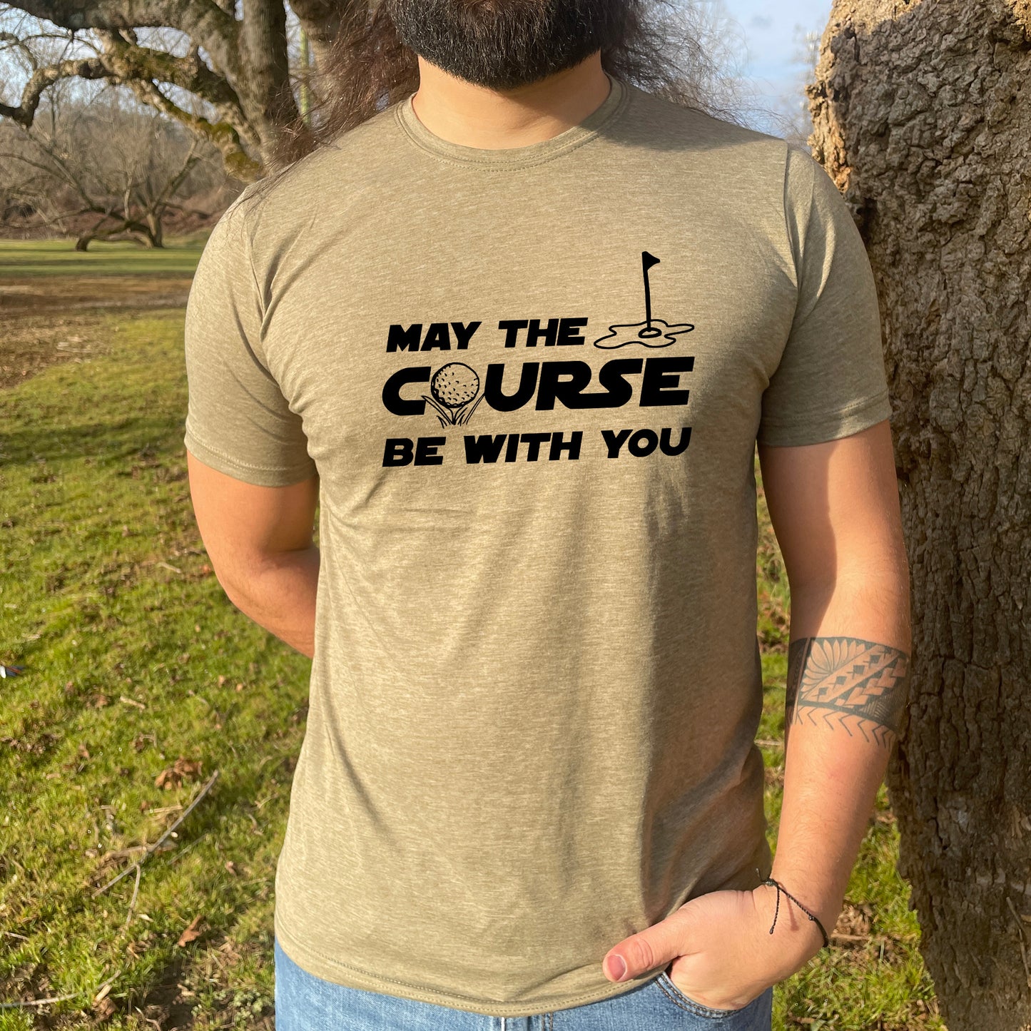 a man with a beard wearing a t - shirt that says, may the course