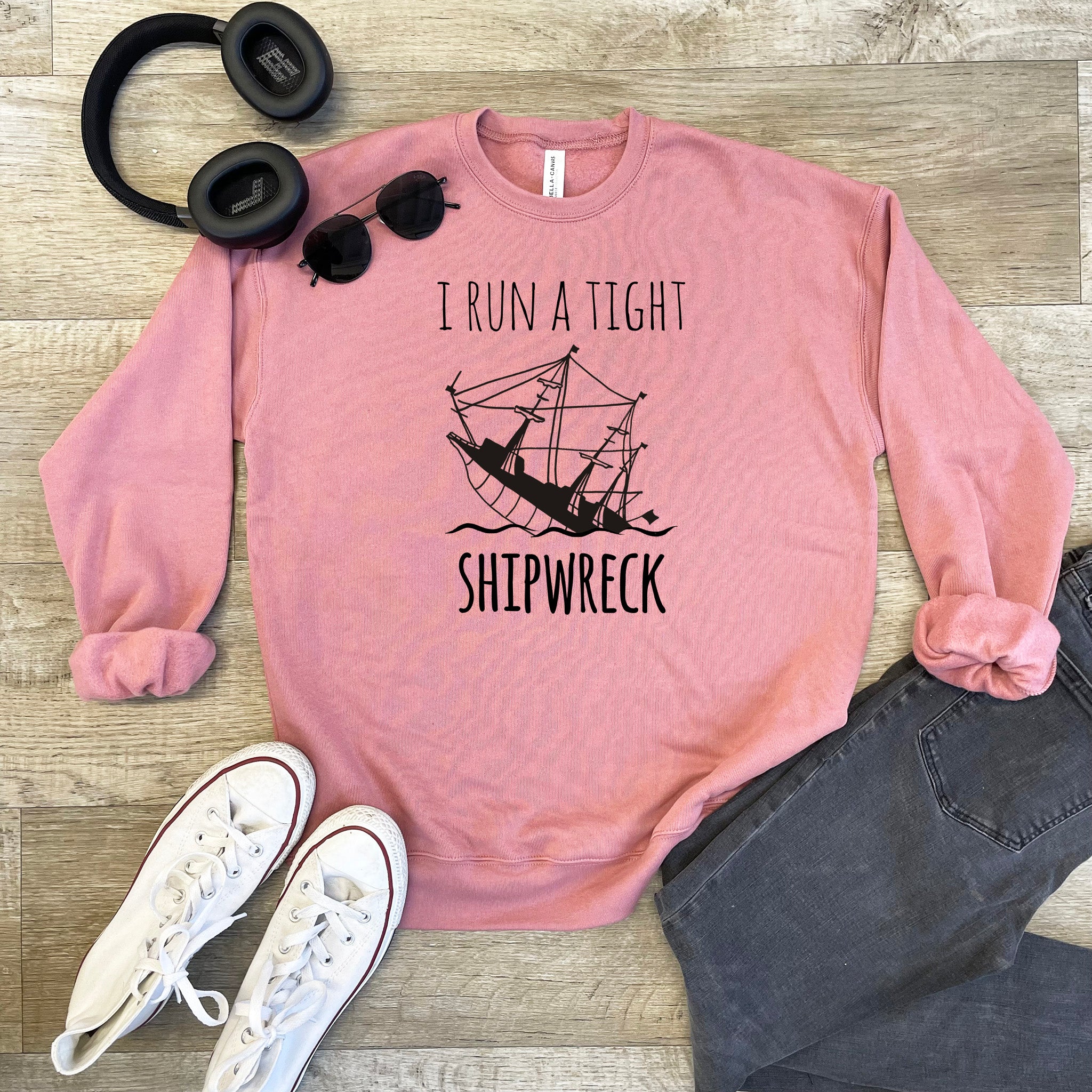 a pink shirt that says i run a tight shipwreck