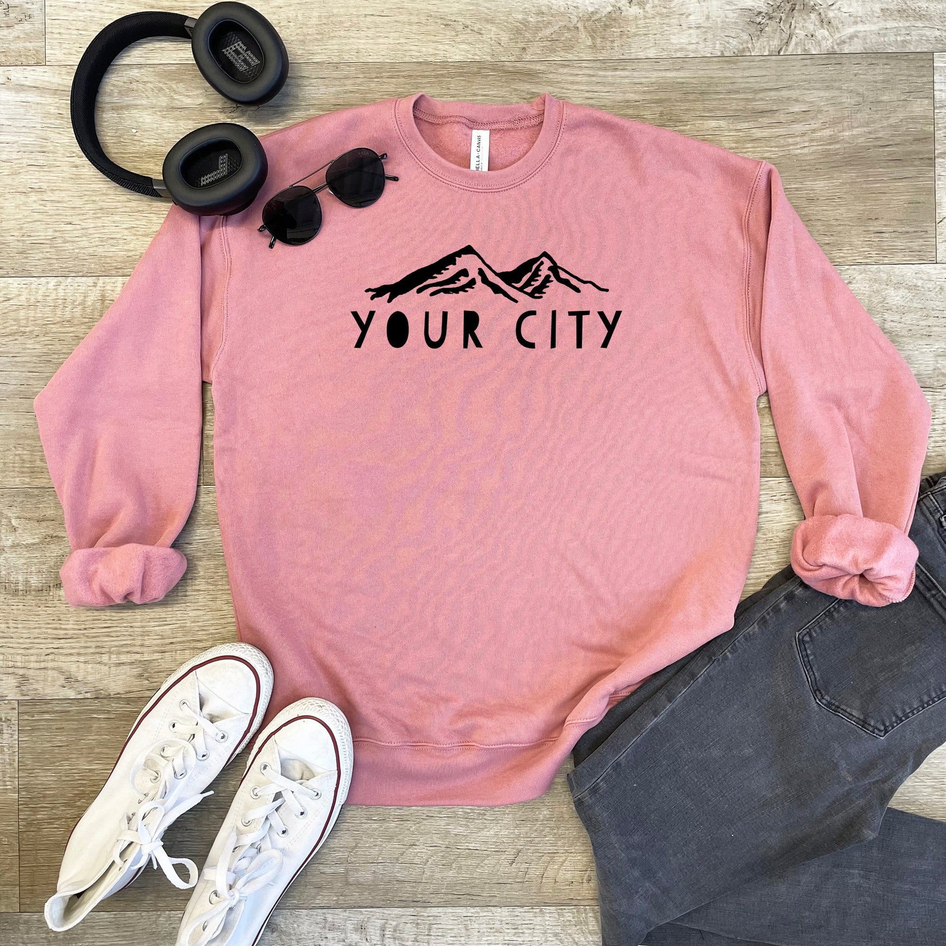 a pink sweatshirt with the words your city on it