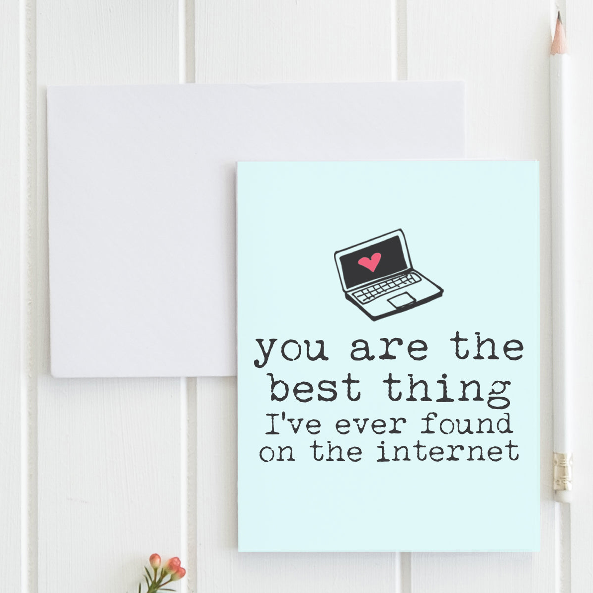 a card with a laptop on top of it