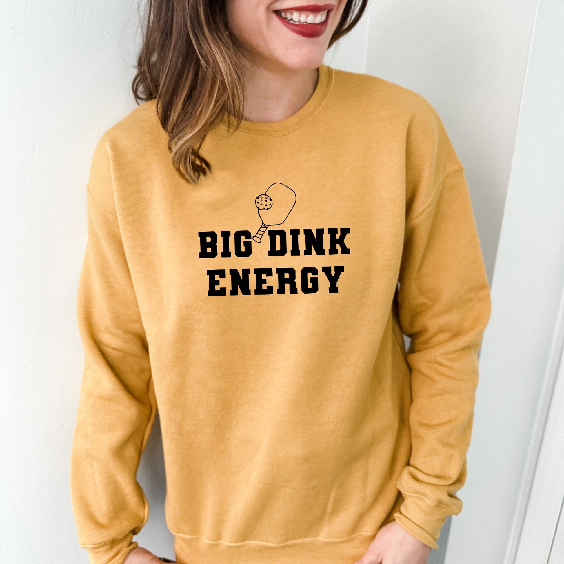 a woman wearing a sweatshirt that says, big drink energy