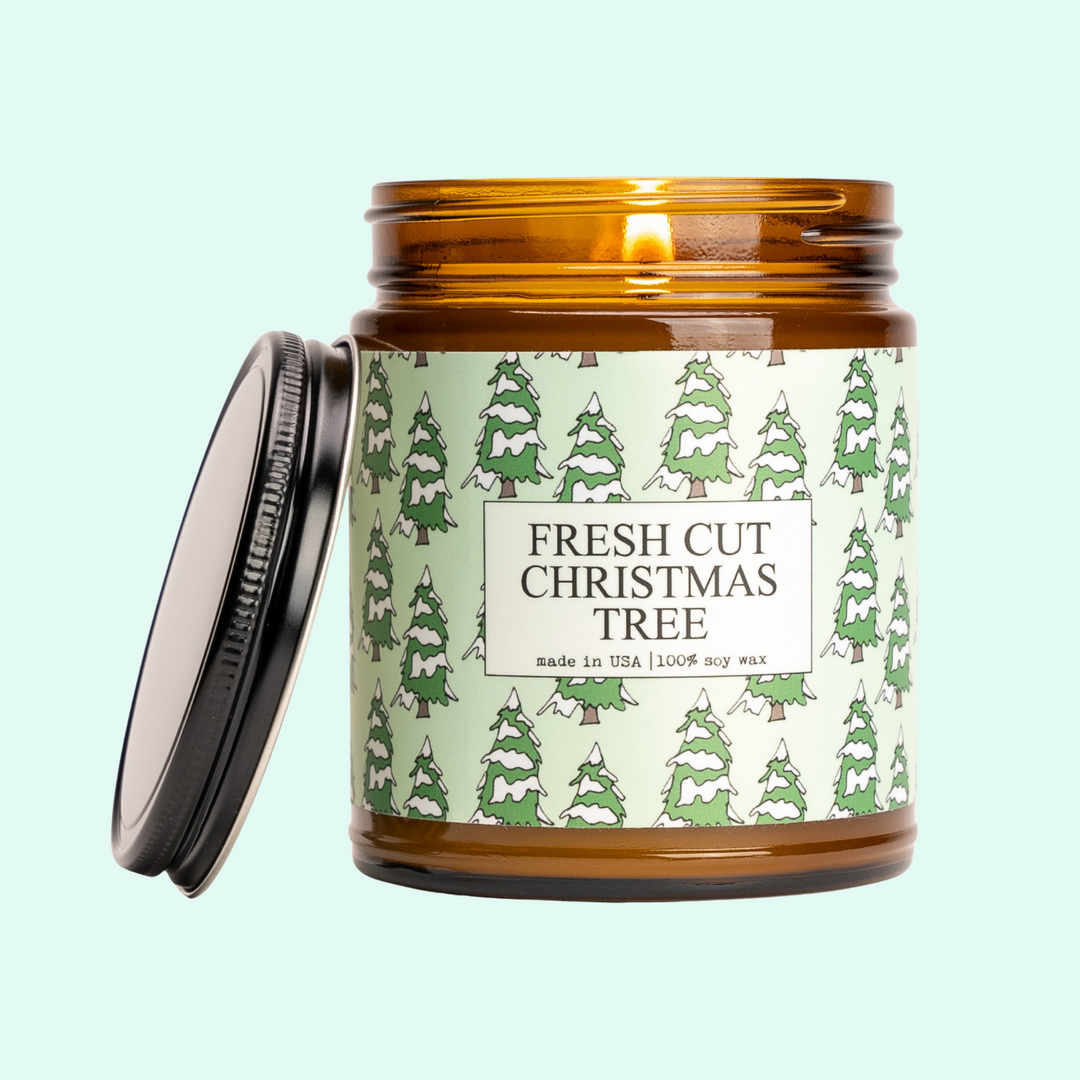 a jar of fresh cut christmas tree candles