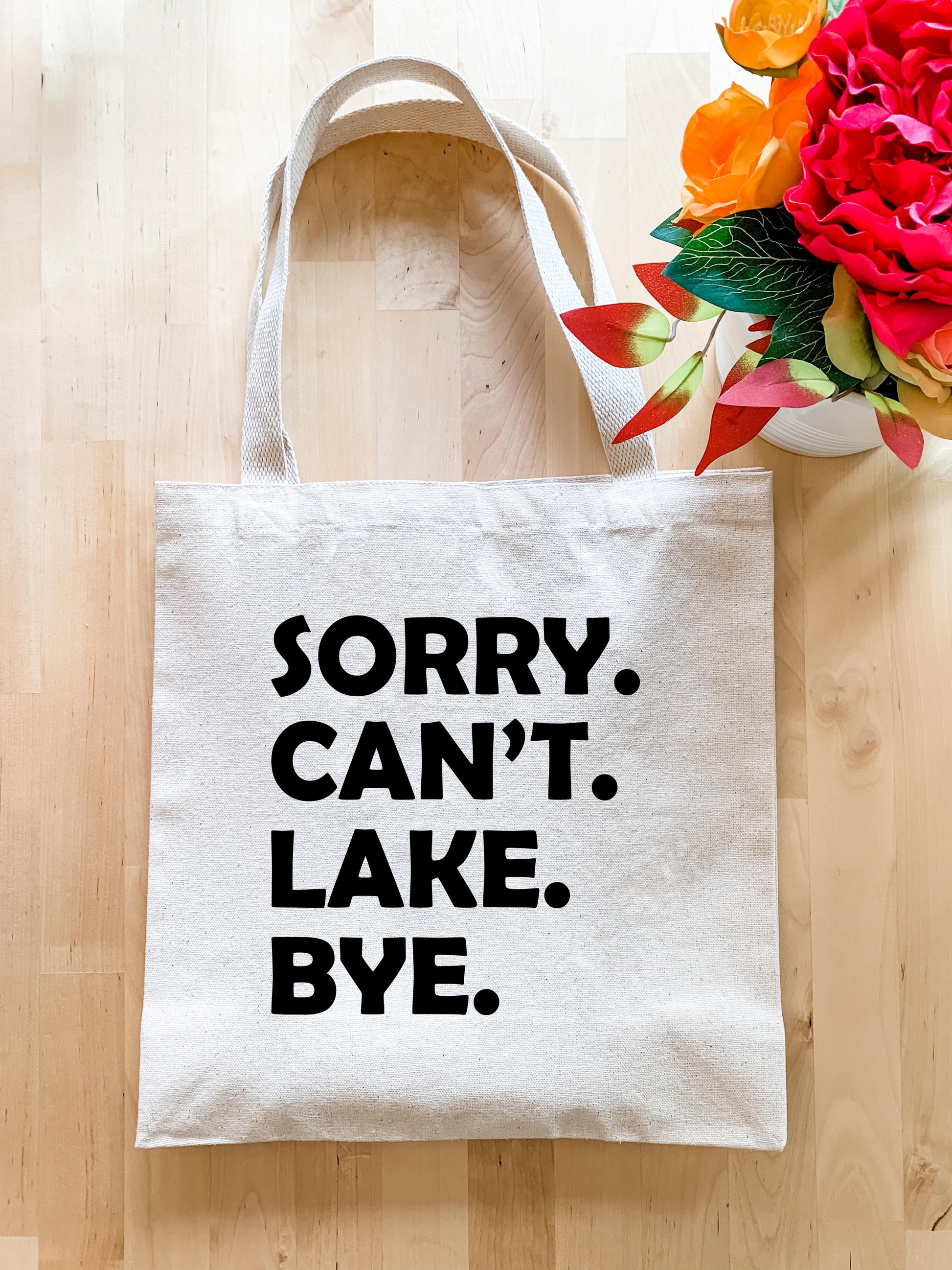 a tote bag that says sorry can't lake bye