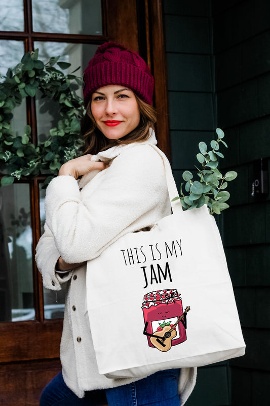 a woman carrying a bag that says, this is my jam