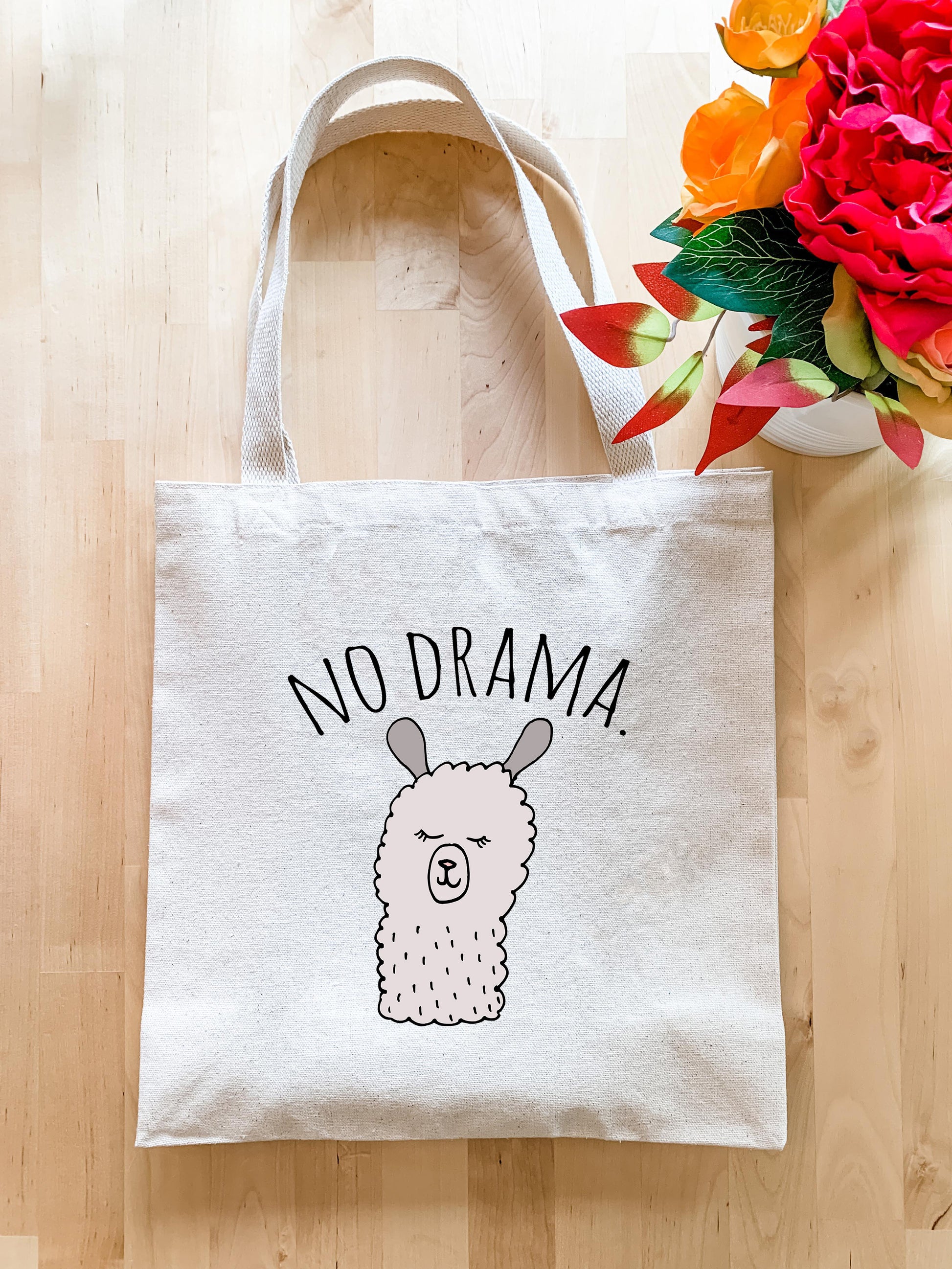 a white bag with a picture of a llama on it