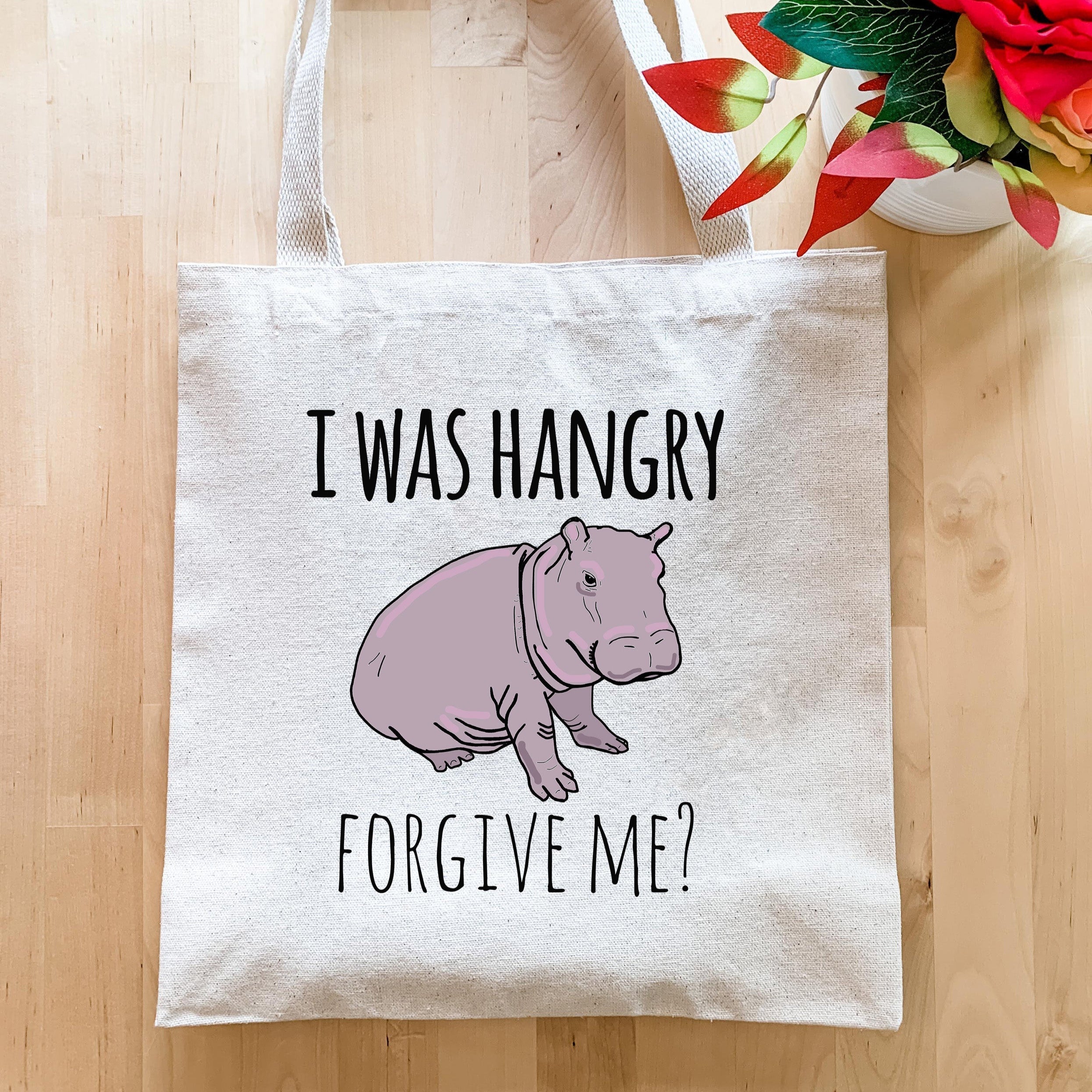 a tote bag with a picture of a hippo on it