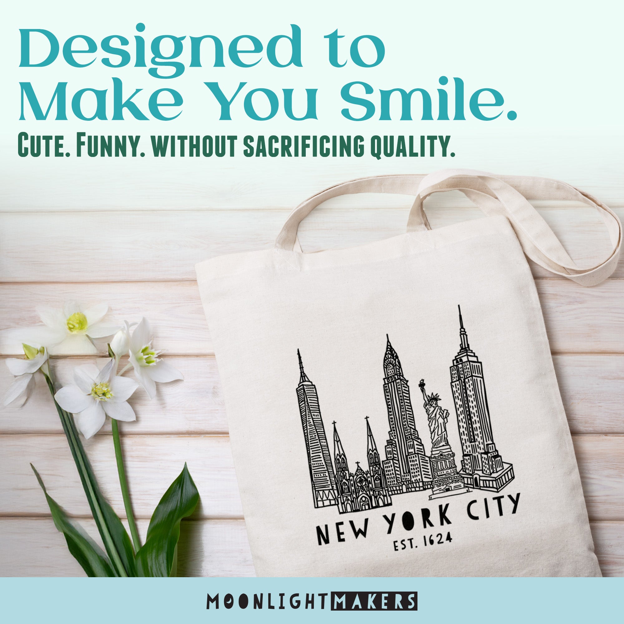 a white tote bag with a graphic of New York City's skyline, placed on a wooden surface alongside a bouquet of white flowers.