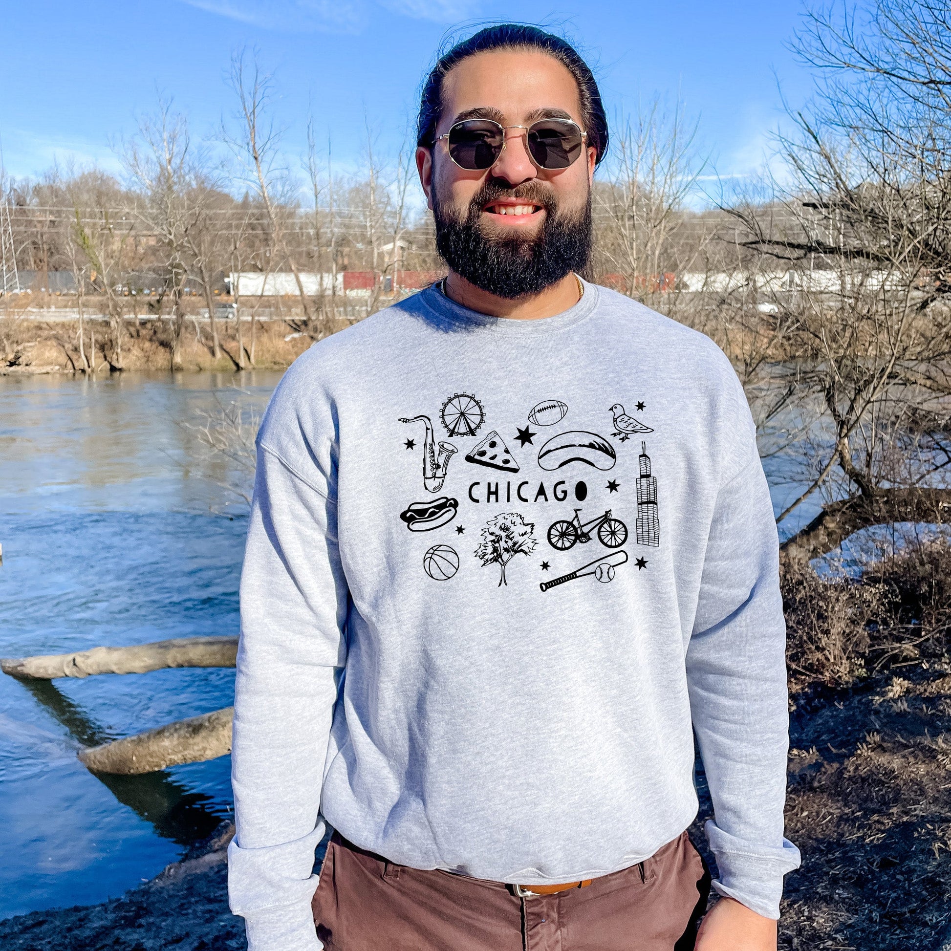 a man standing in front of a body of water