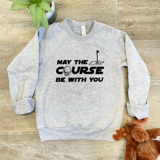 a grey sweatshirt with the words may the course be with you next to a teddy