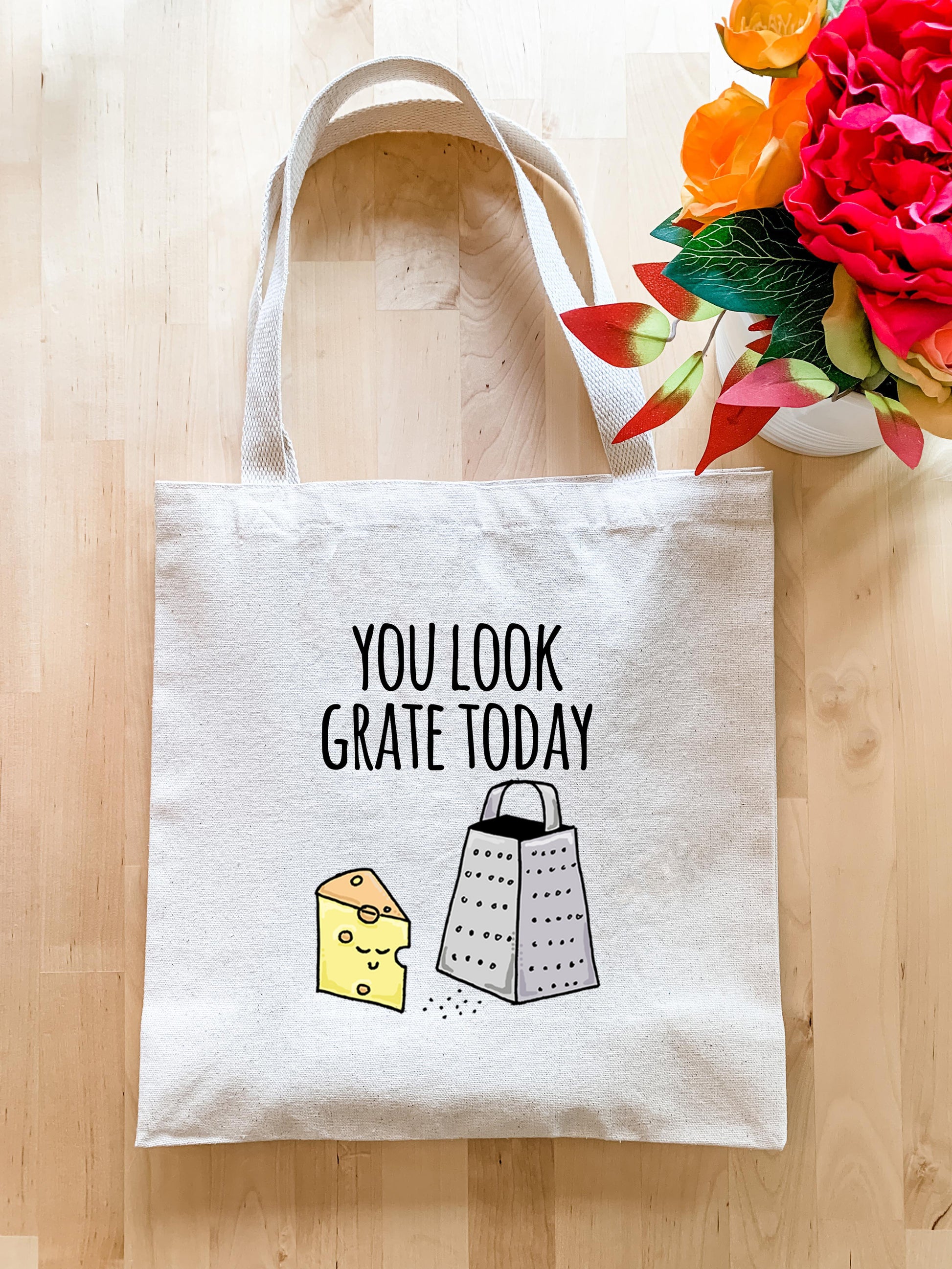a tote bag with a piece of cheese on it