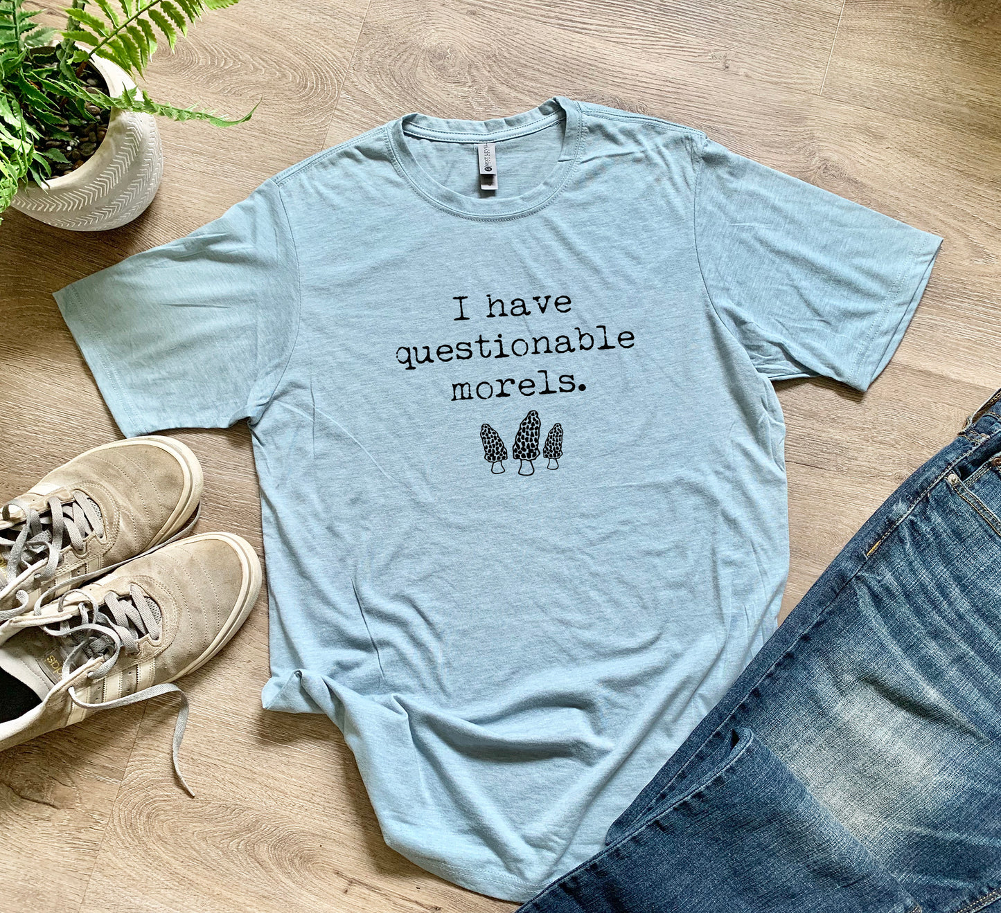 a t - shirt that says i have questionable morses next to a pair of