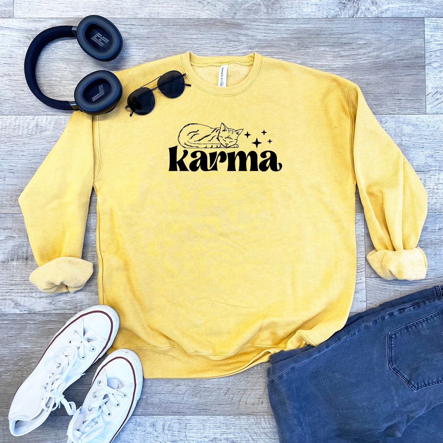 a yellow sweatshirt with the word karma on it