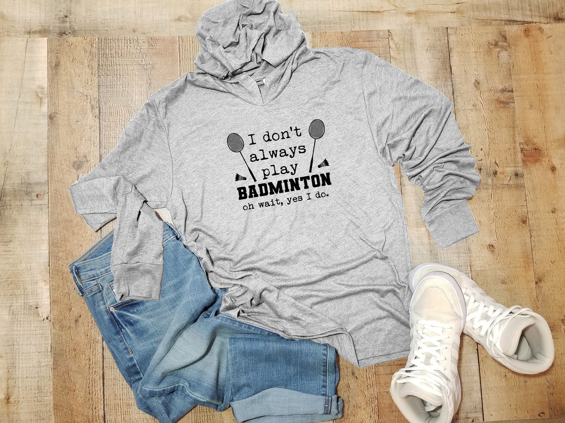 a gray hoodie that says i don't always play badminton