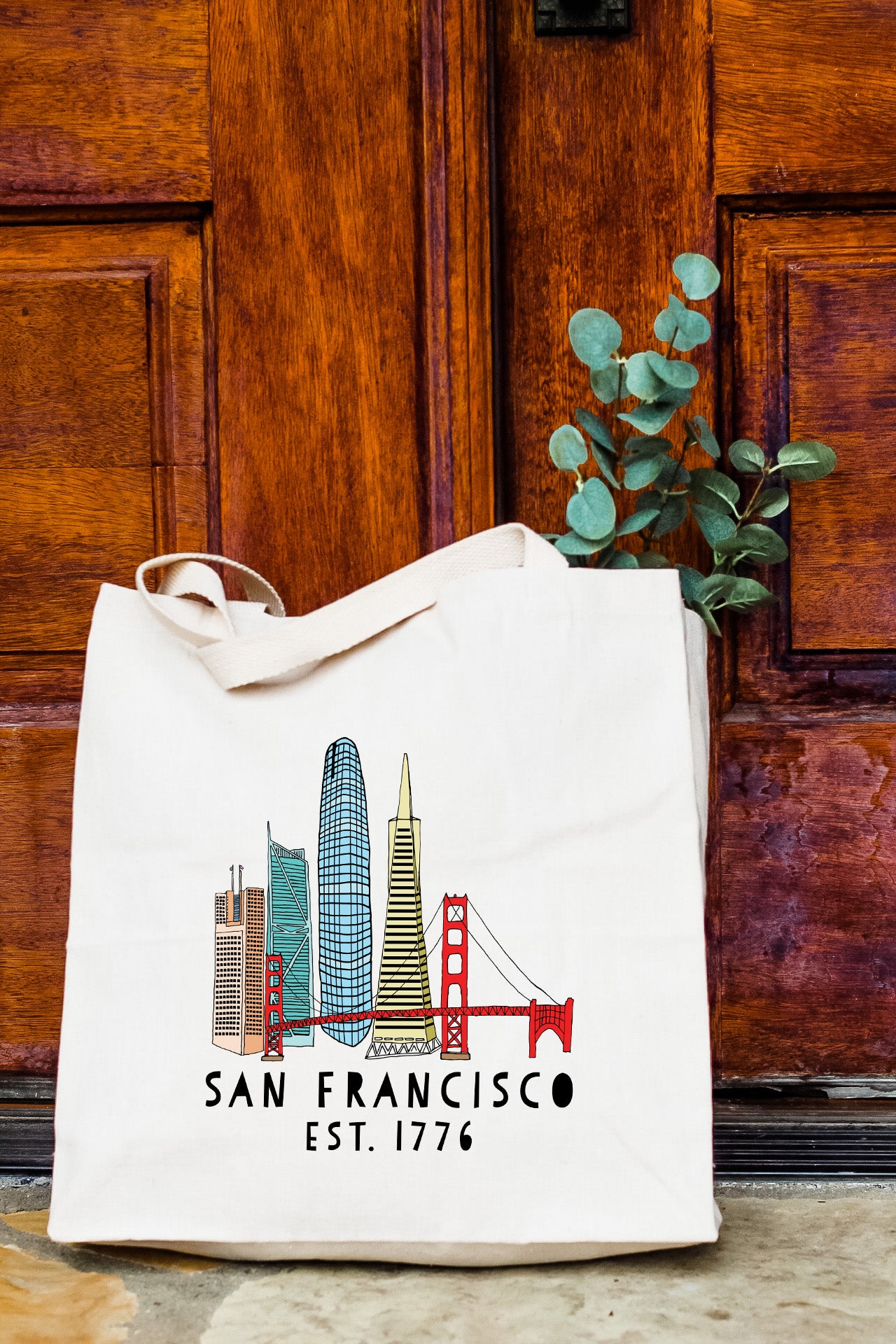 a san francisco bag sitting in front of a door