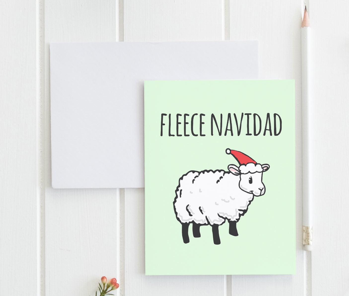 a card with a picture of a sheep wearing a santa hat