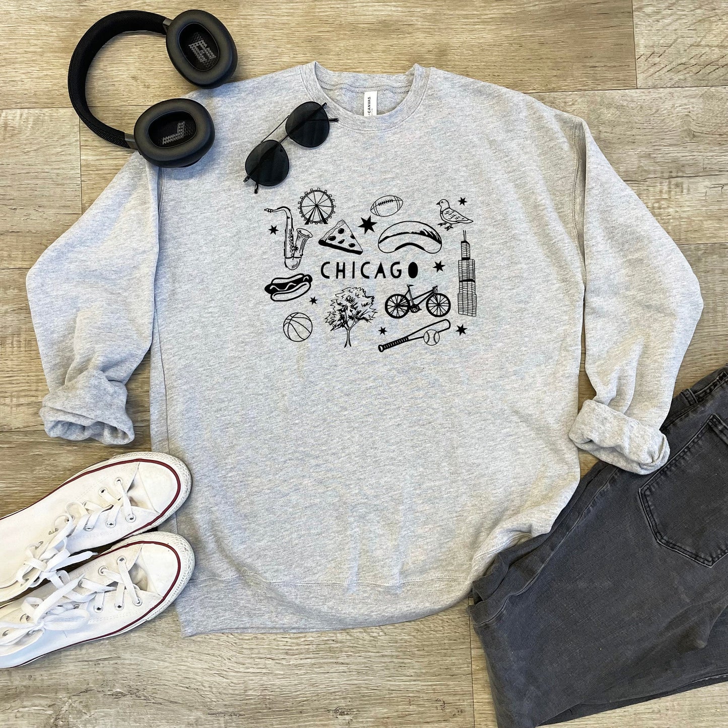 a chicago sweatshirt with headphones, headphones, and a pair of jeans