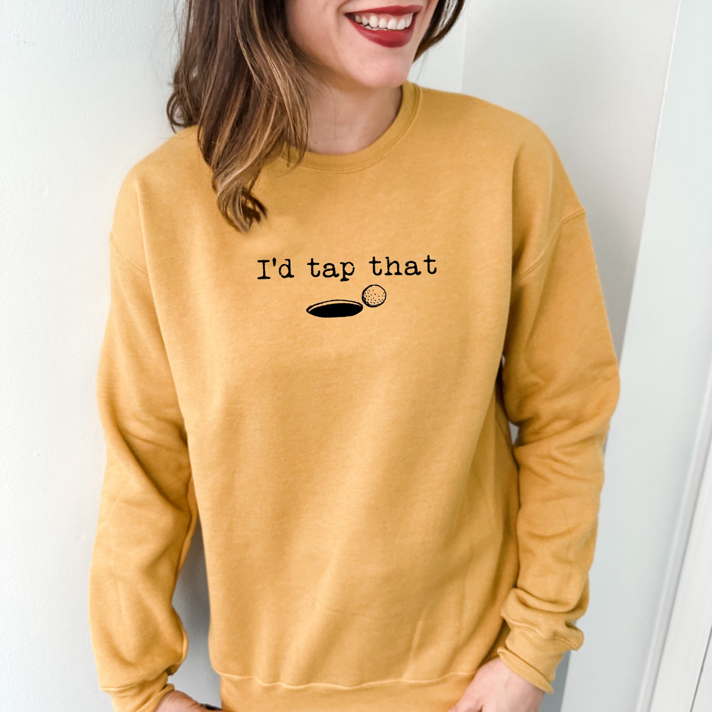 a woman wearing a sweatshirt that says i'd tap that