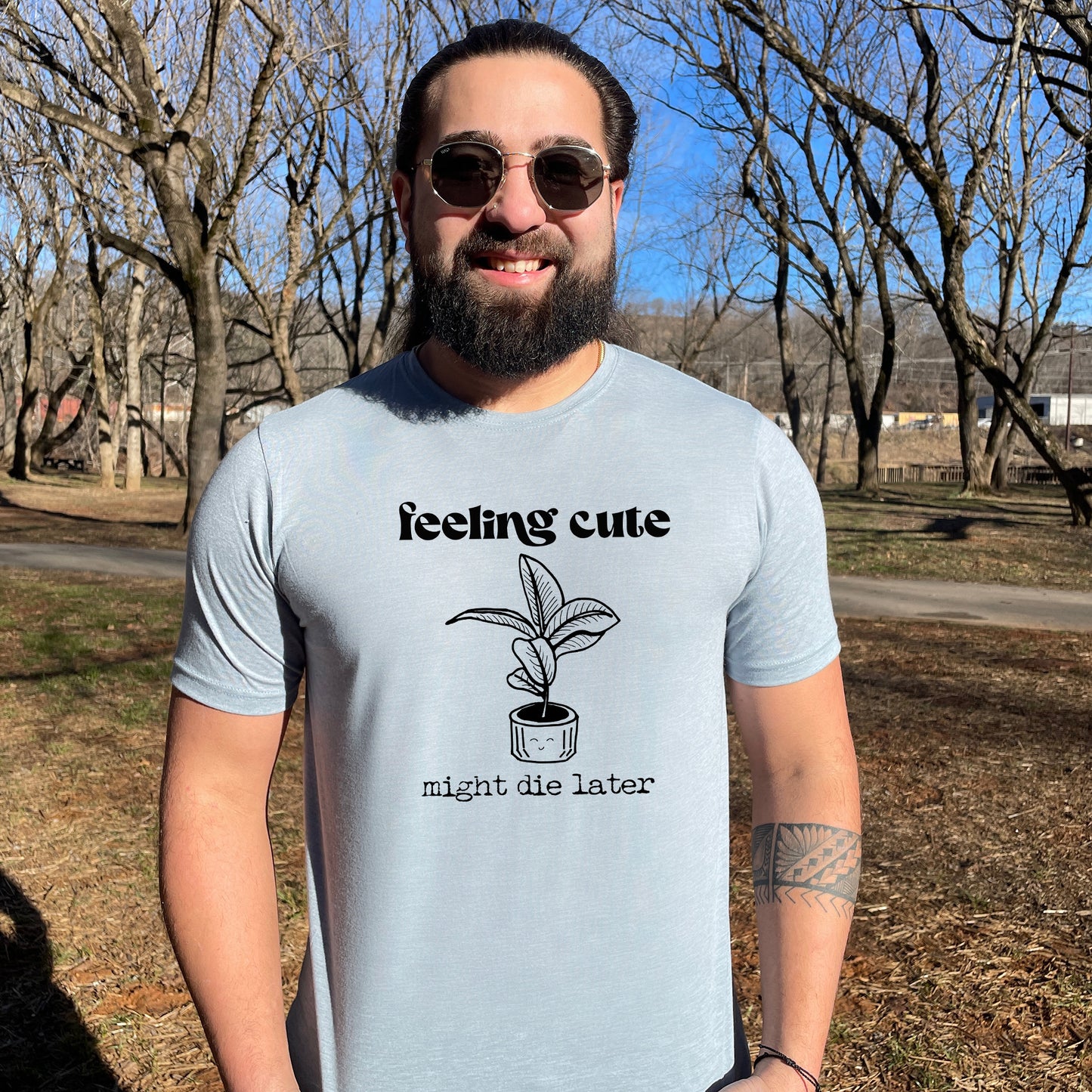 a man with a beard wearing a t - shirt that says teething cute
