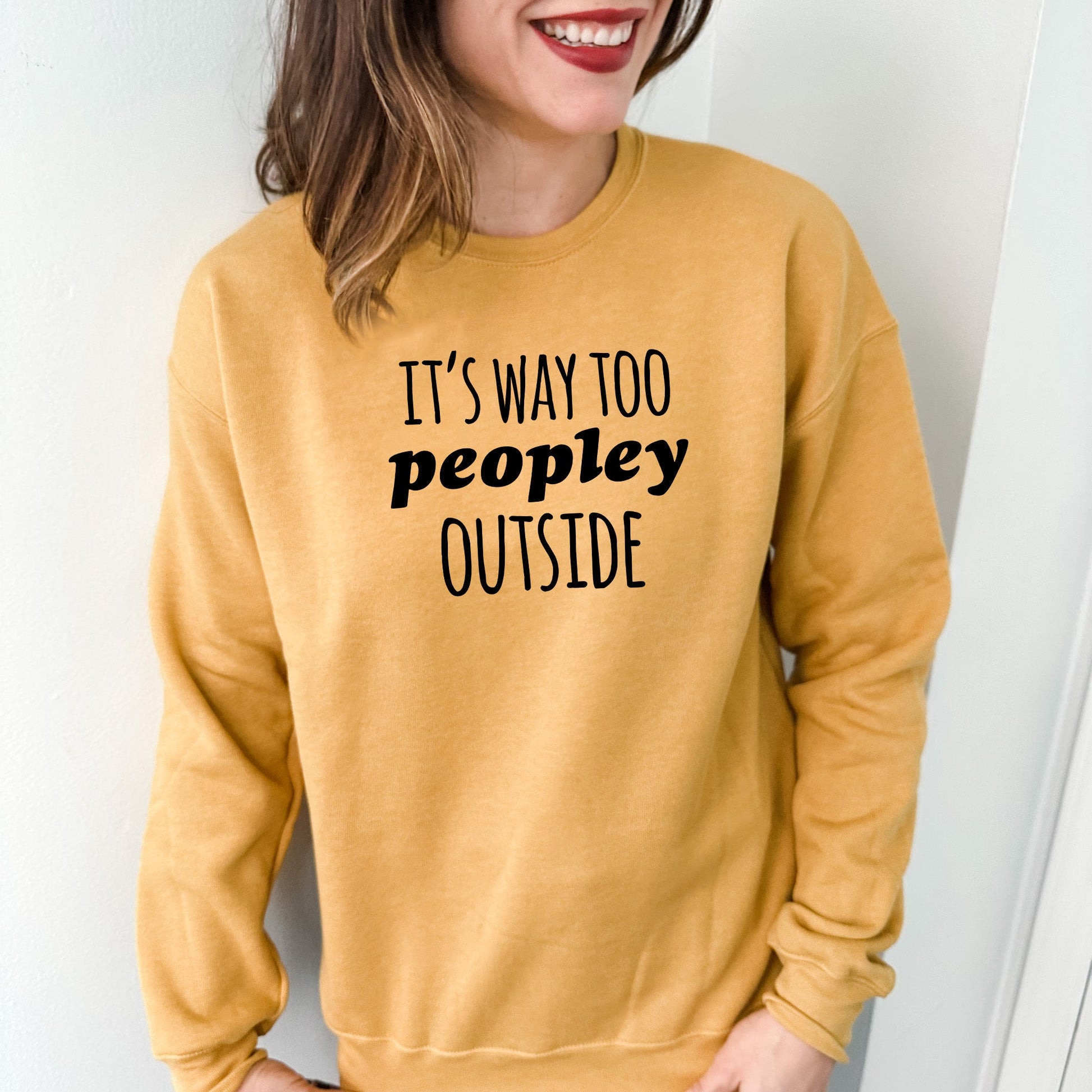 a woman wearing a sweatshirt that says it's way to people outside