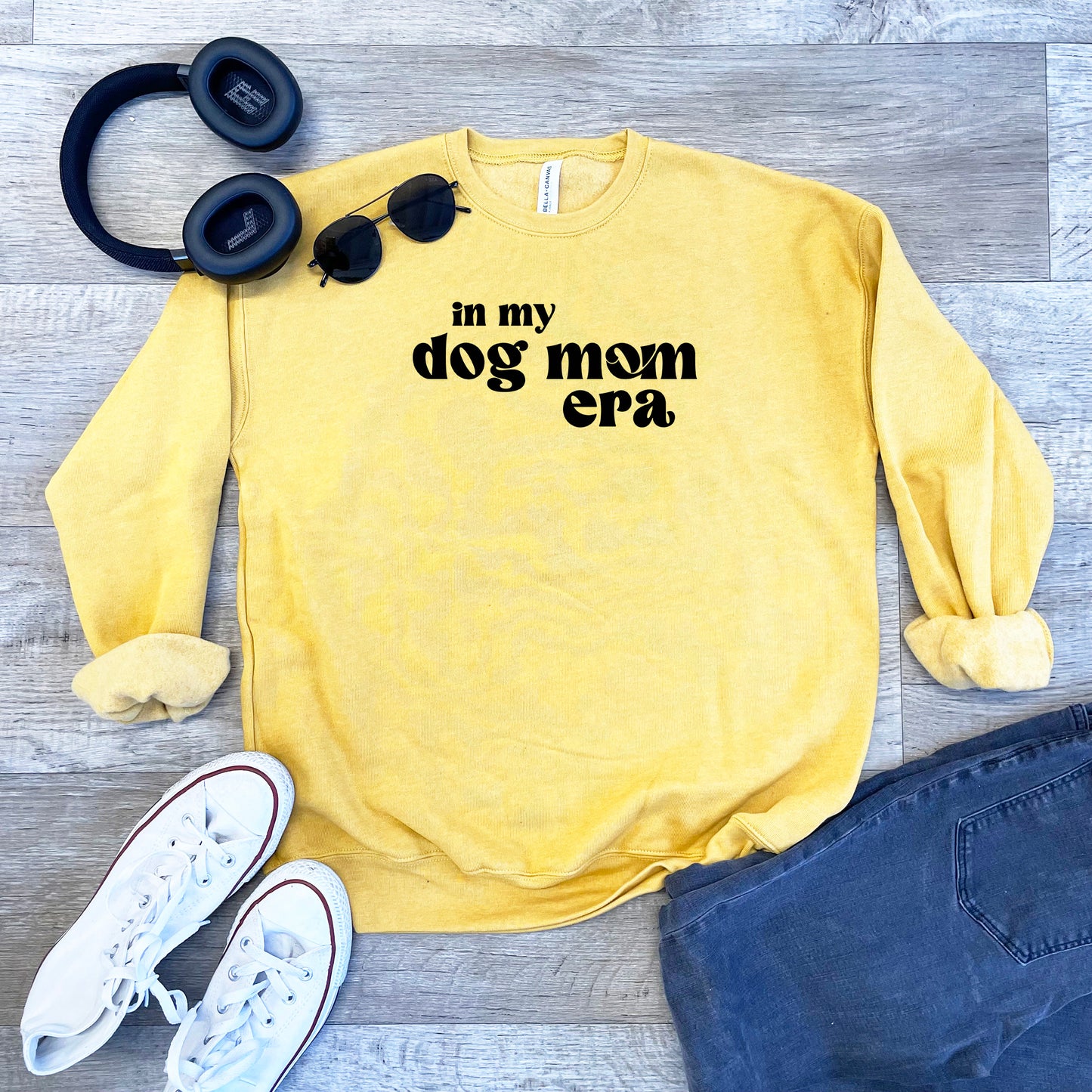 a yellow sweatshirt with the words in my dog mom era on it