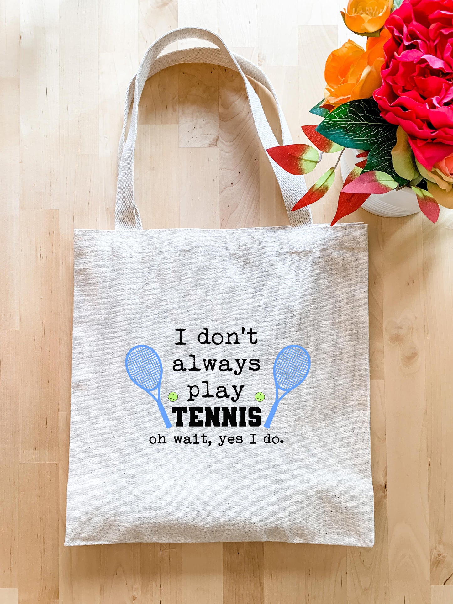 a tote bag sitting on top of a wooden floor