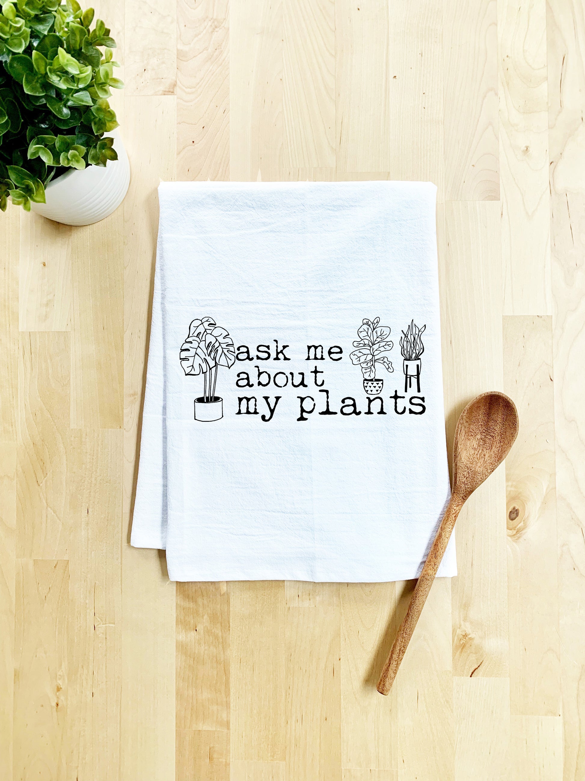 a tea towel that says ask me about my plants