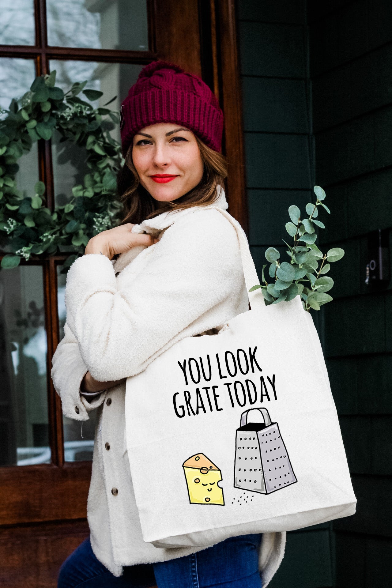 a woman carrying a bag that says you look grate today