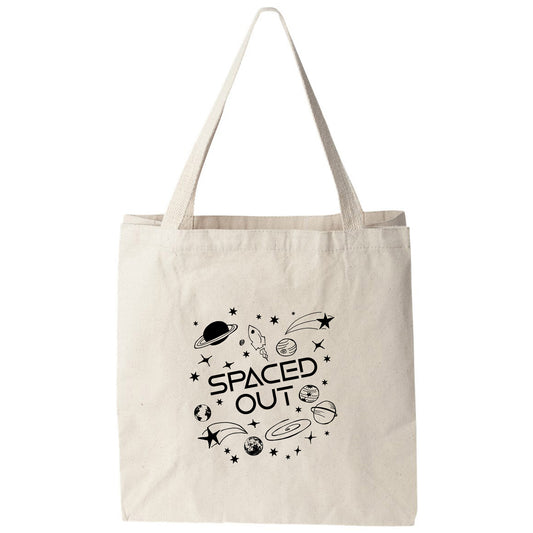 a white tote bag with space out on it