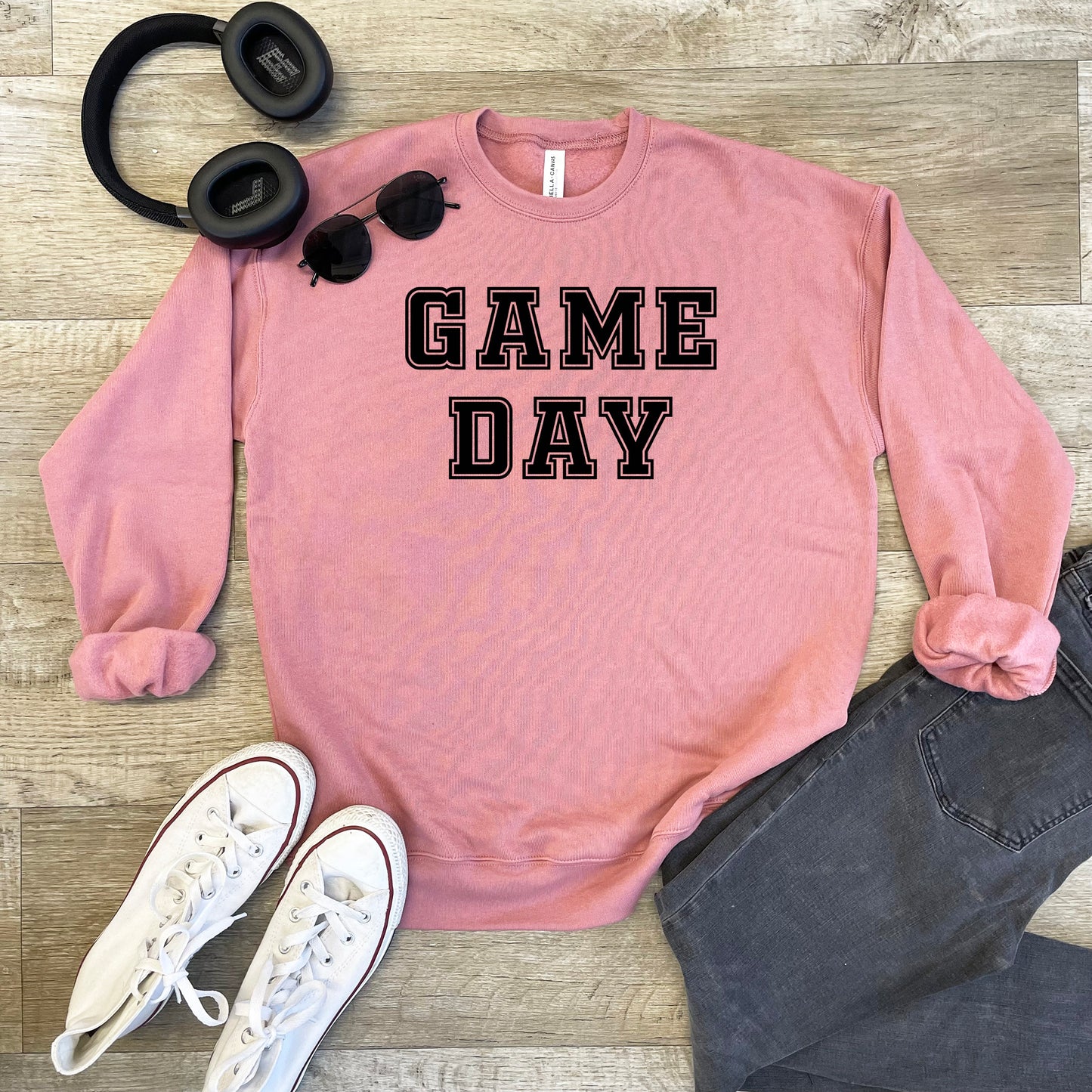 a pink sweatshirt with game day written on it