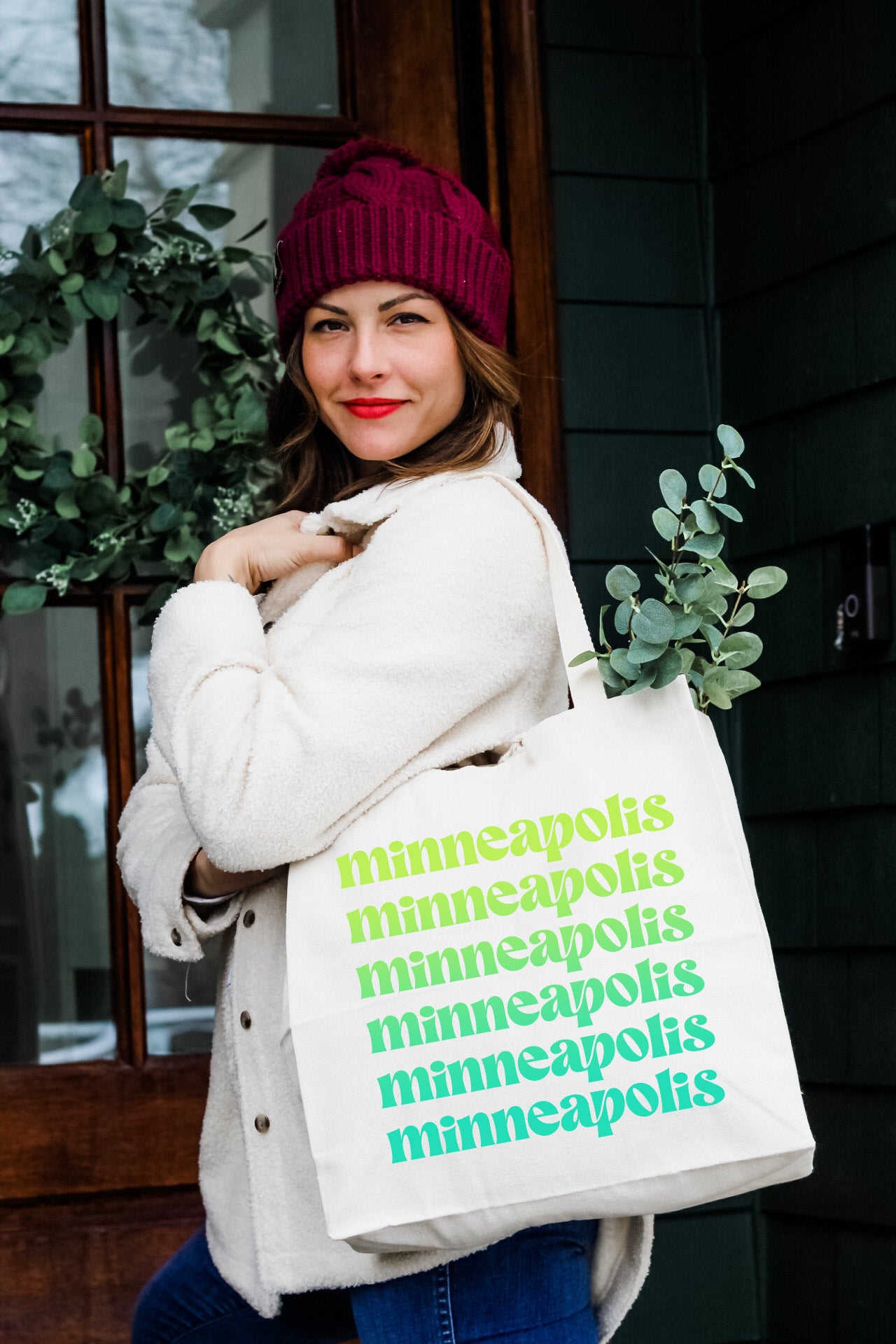 a woman carrying a bag with a message on it