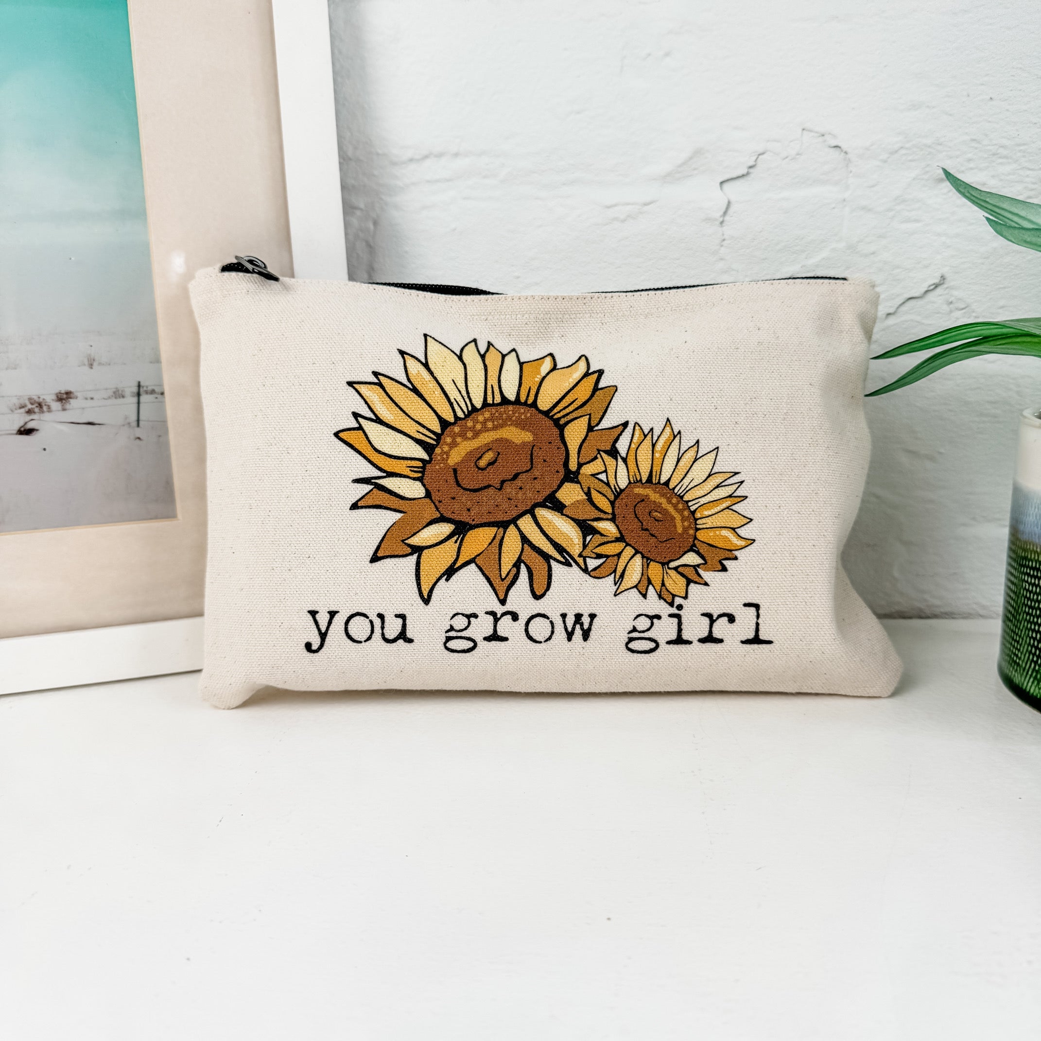 a pillow that has a picture of a sunflower on it