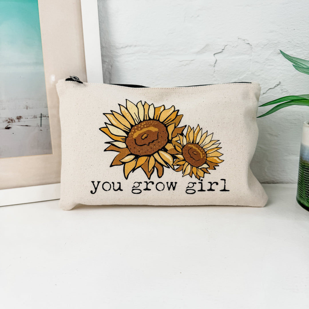 a pillow that has a picture of a sunflower on it