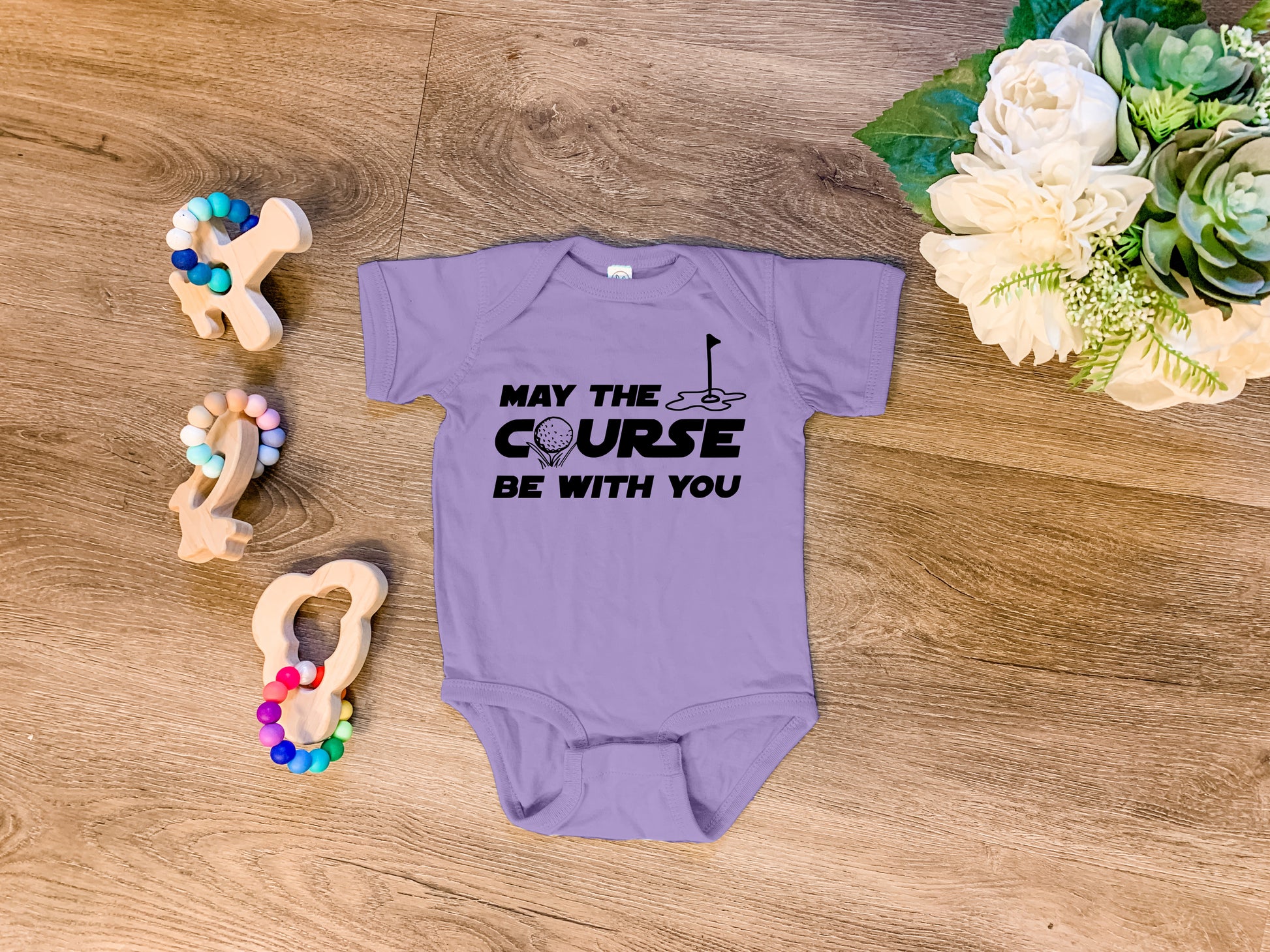 a baby bodysuit that says, may the course be with you