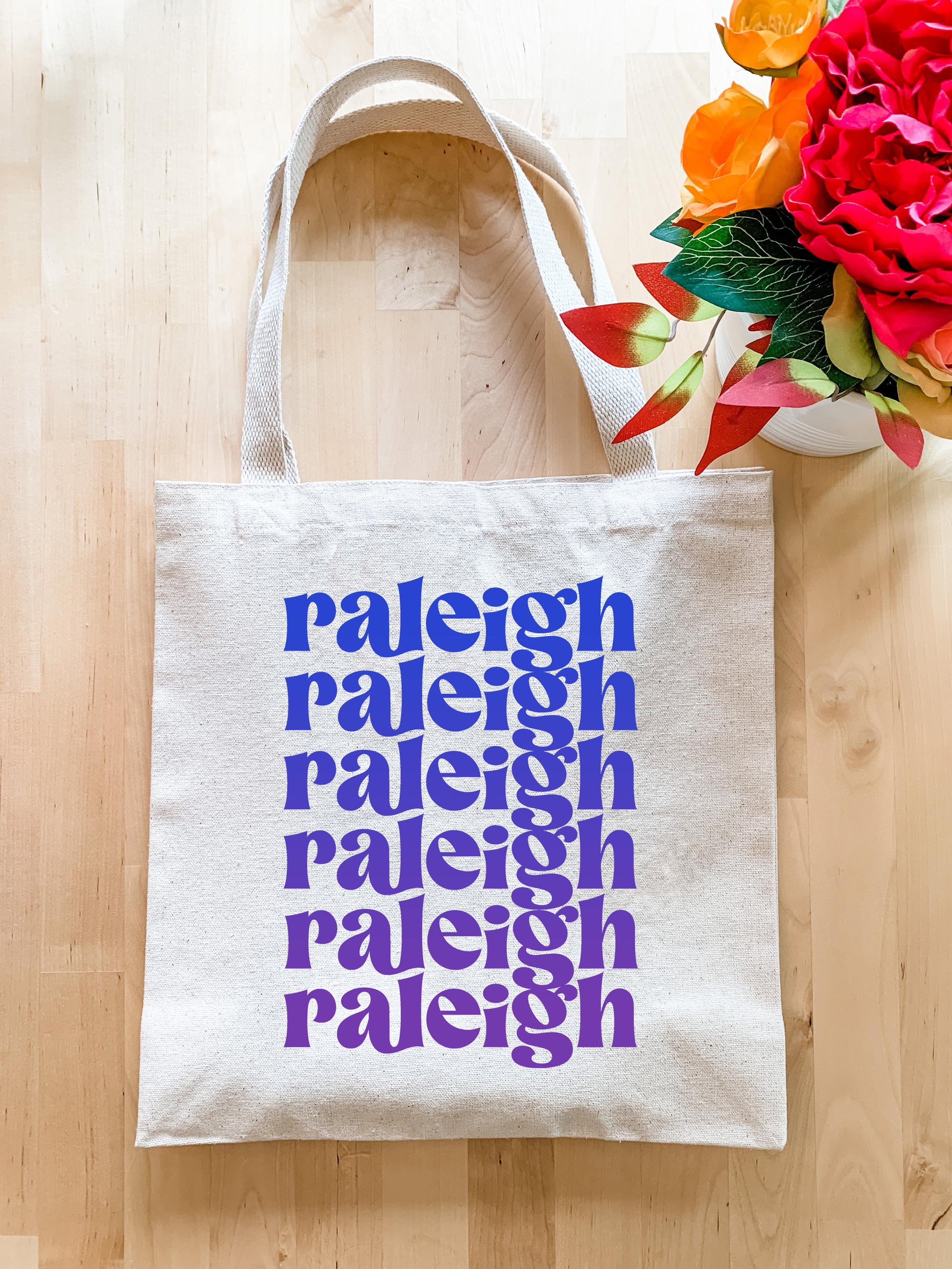 a tote bag sitting on top of a wooden floor