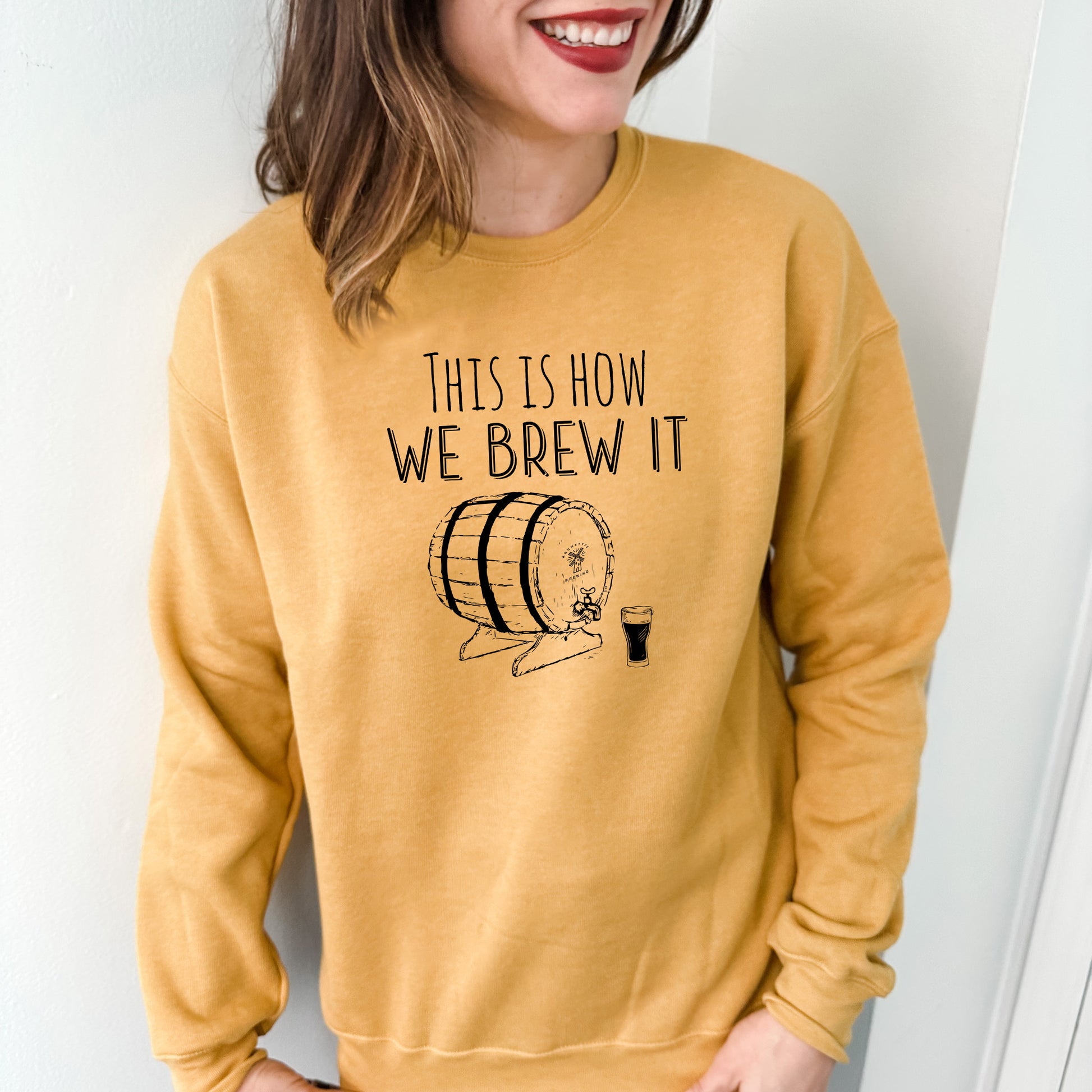 a woman wearing a sweatshirt that says, this is how we brew it