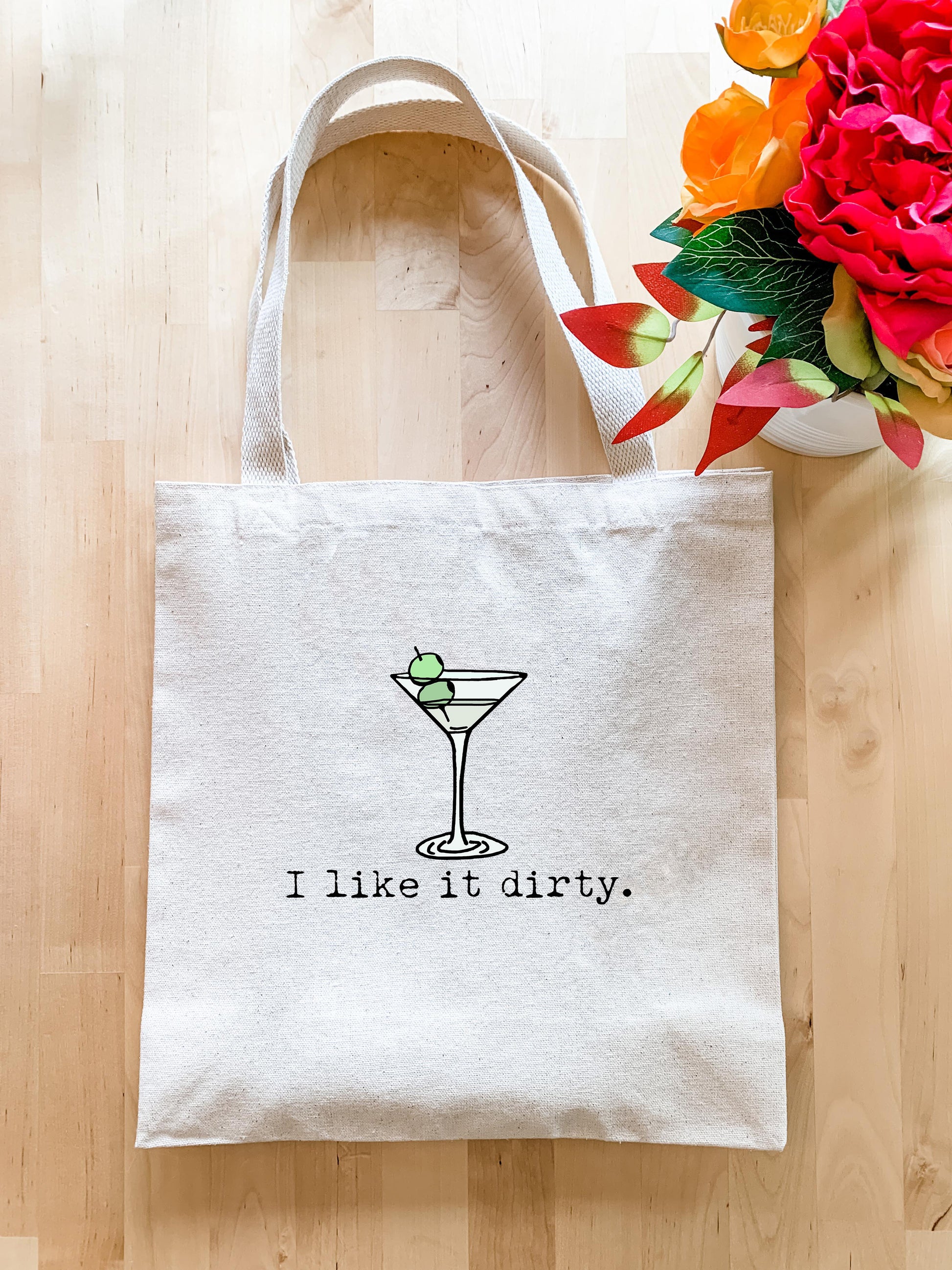 a white tote bag with the words i like dirty on it