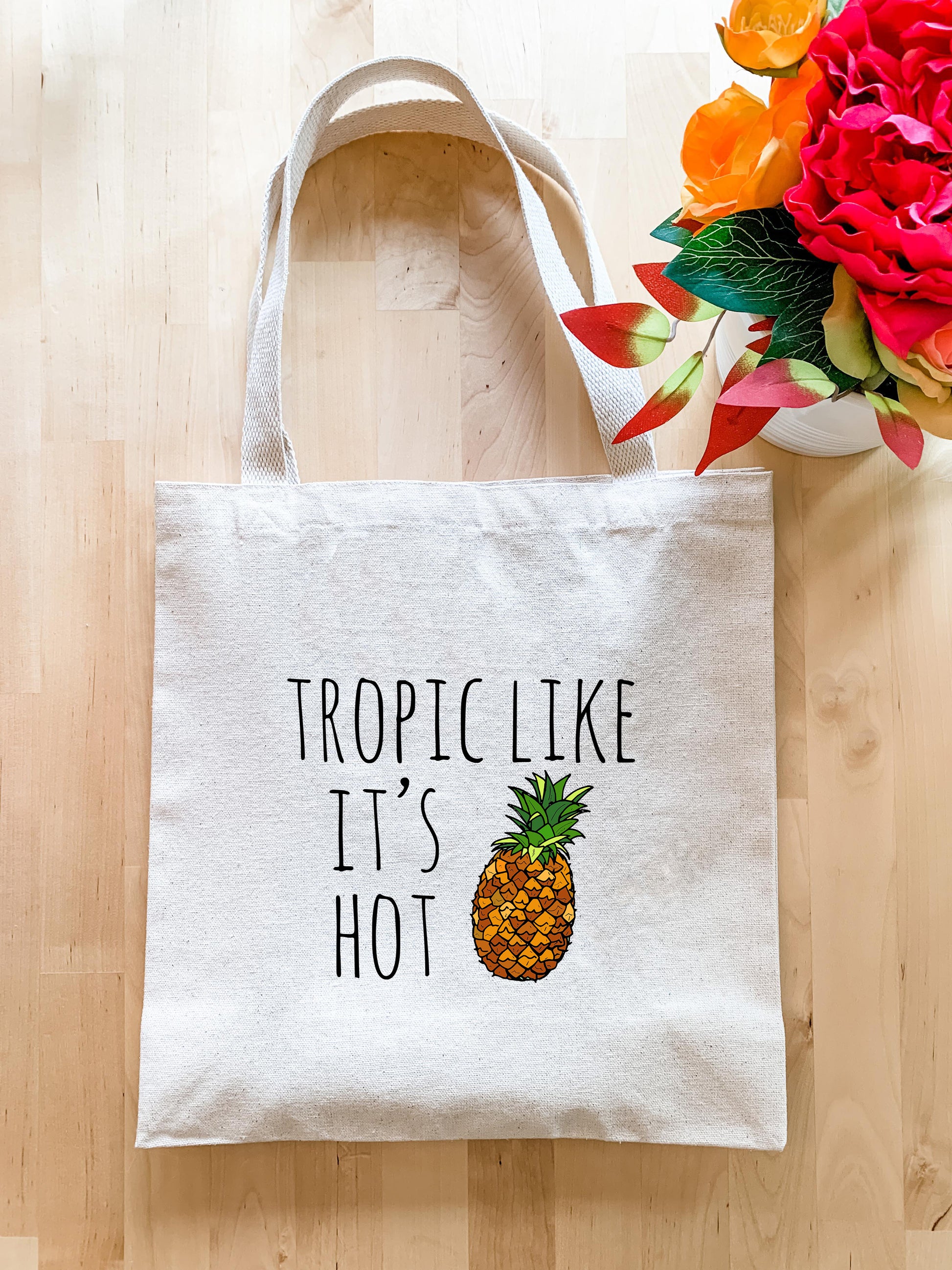 a tote bag with a pineapple printed on it